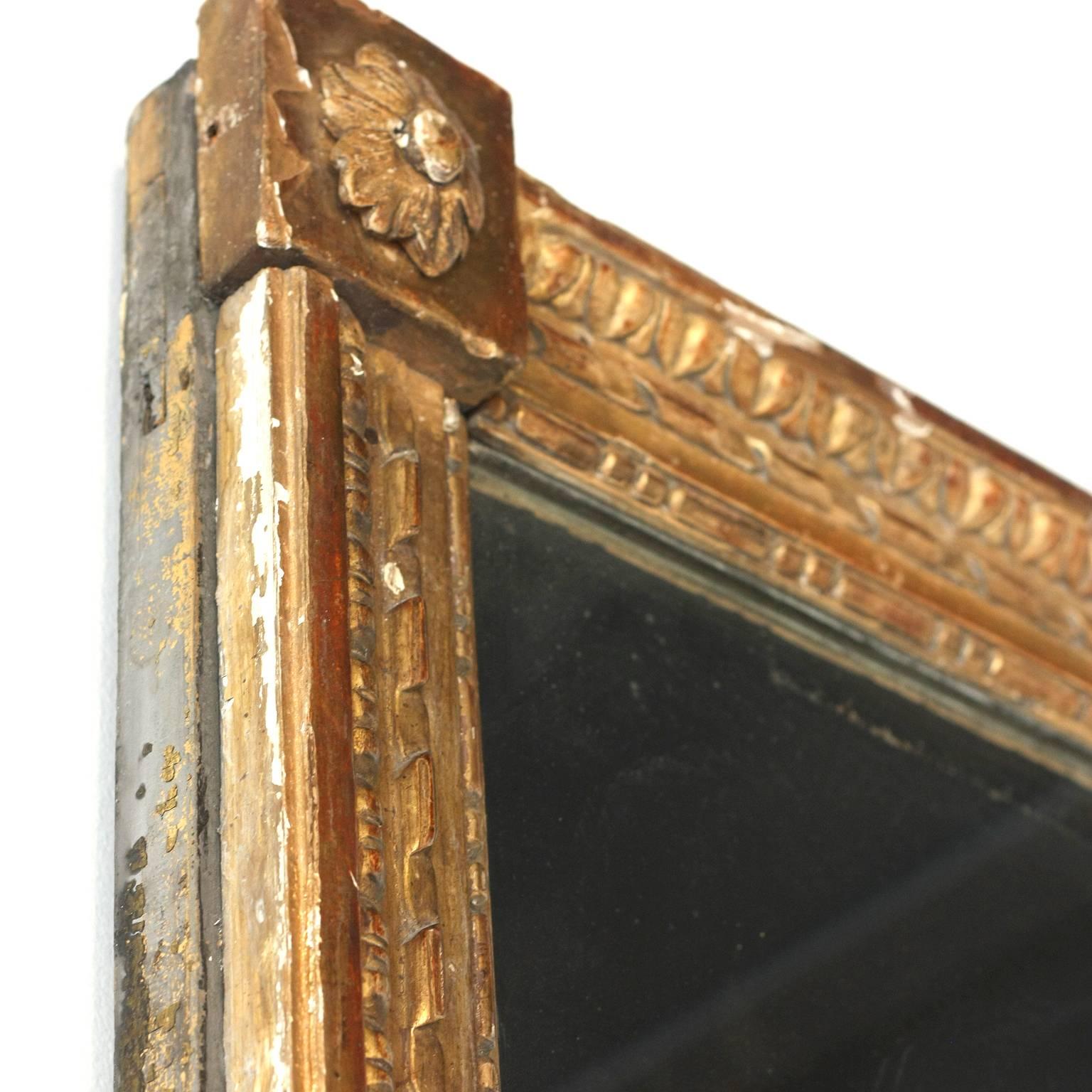 Early 19th century, French giltwood mirror, the fluted rectangular giltwood border surrounding conforming mirror.