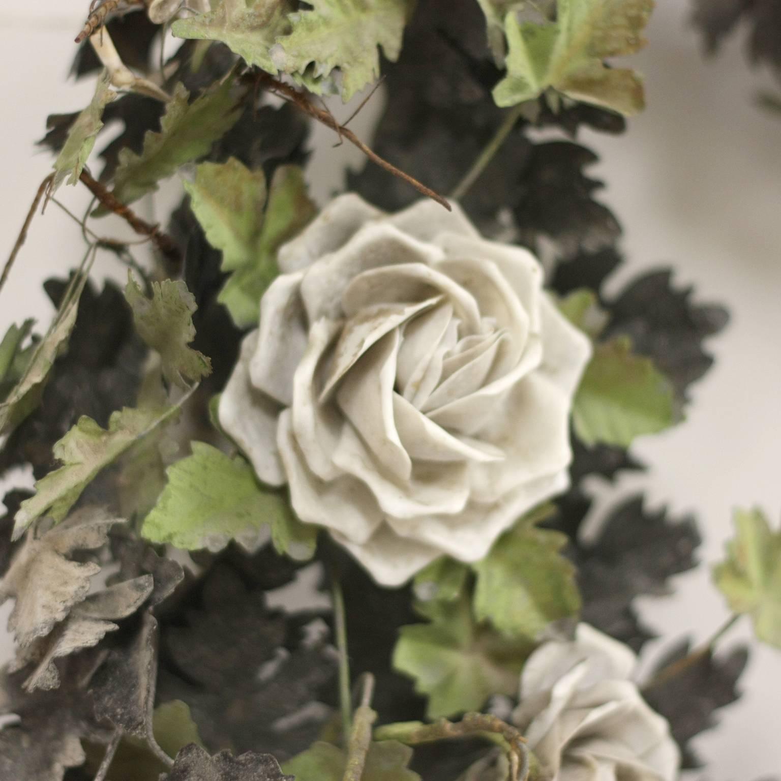 Painted tole wreath with handcrafted Roses. Perfect for hanging or as a centerpiece.