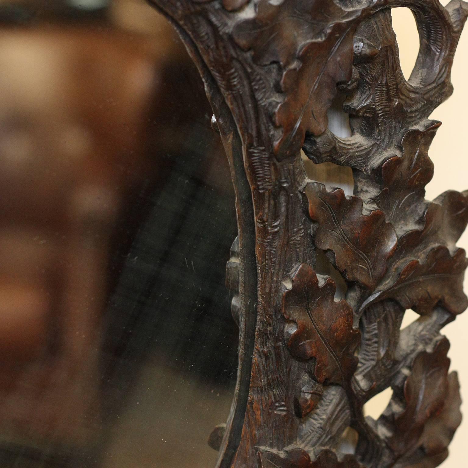 French Black Forest 19th Century Oak Leaves Carved Mirror with Oval Glass 1