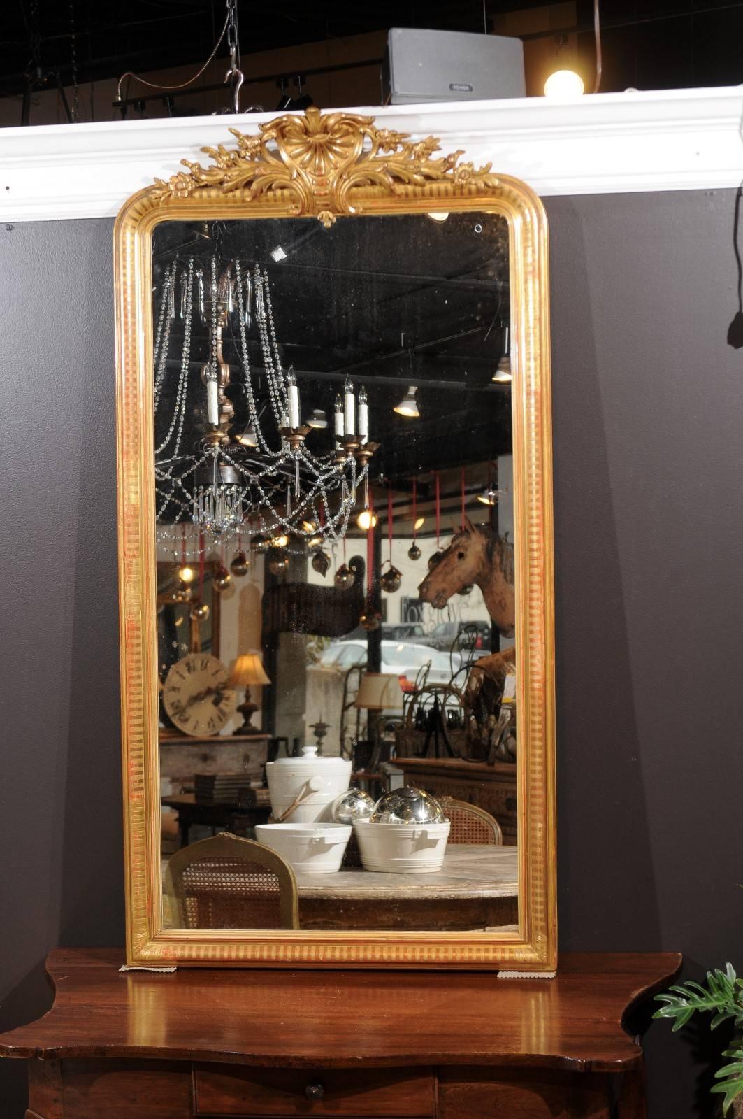 French Rococo Style Tall Giltwood Mirror with Carved Crest from the 1880s In Good Condition In Atlanta, GA