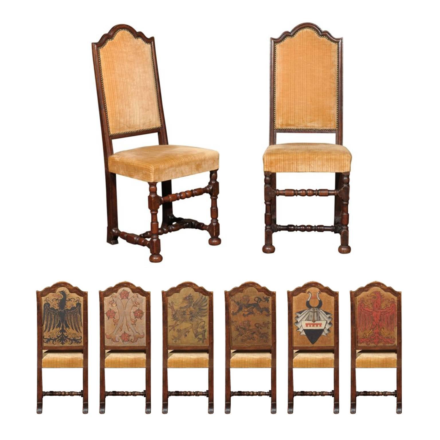 Set of mid-19th century Florentine dining chairs, the shaped open back seat surmounting a conforming seat upholstered in yellow velvet and raised on straight and turned legs with a conforming stretcher, each with a hand-painted family crest on the