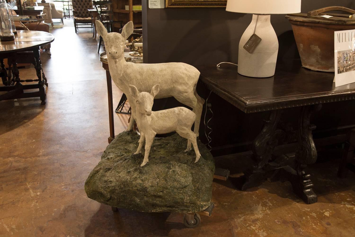 Mid-Century Modern Pair of English Mid-Century Cast Stone Sculptures of a Doe and Her Fawn on Base