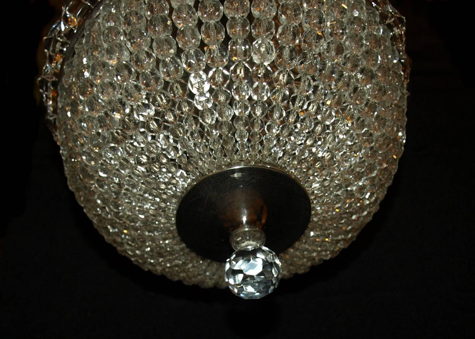 Petite basket style chandelier with one inside light.