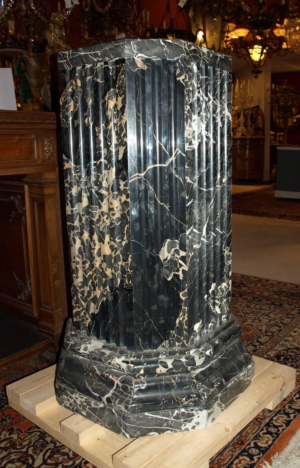 Very fine pair of portoro marble pedestals having an octagonal shape with reeded center pillar. The top is 18 inches by 18 inches. The base is 24 inches by 24 inches.
CW4381 & CW4930
Portoro is a fine-grained, black marble with gold veining