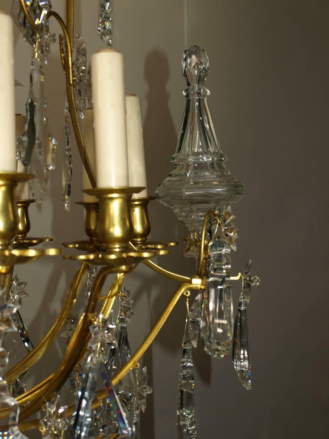 Very fine Louis XV cage style gilt bronze and crystal twelve-light chandelier by Baccarat. Originally for candles, now electrified.