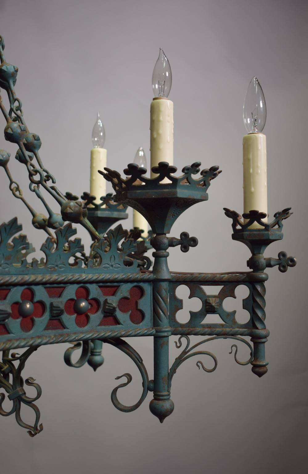 Very fine 19th century French Gothic style chandelier of painted iron with the original finish. Was originally for candles, now electrified. Twelve lights in two tiers.