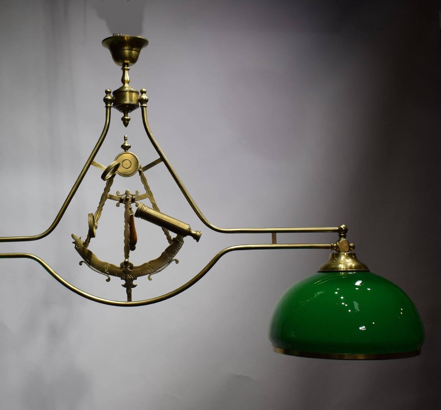 Fine two-light billiard chandelier featuring surveyor's tools.