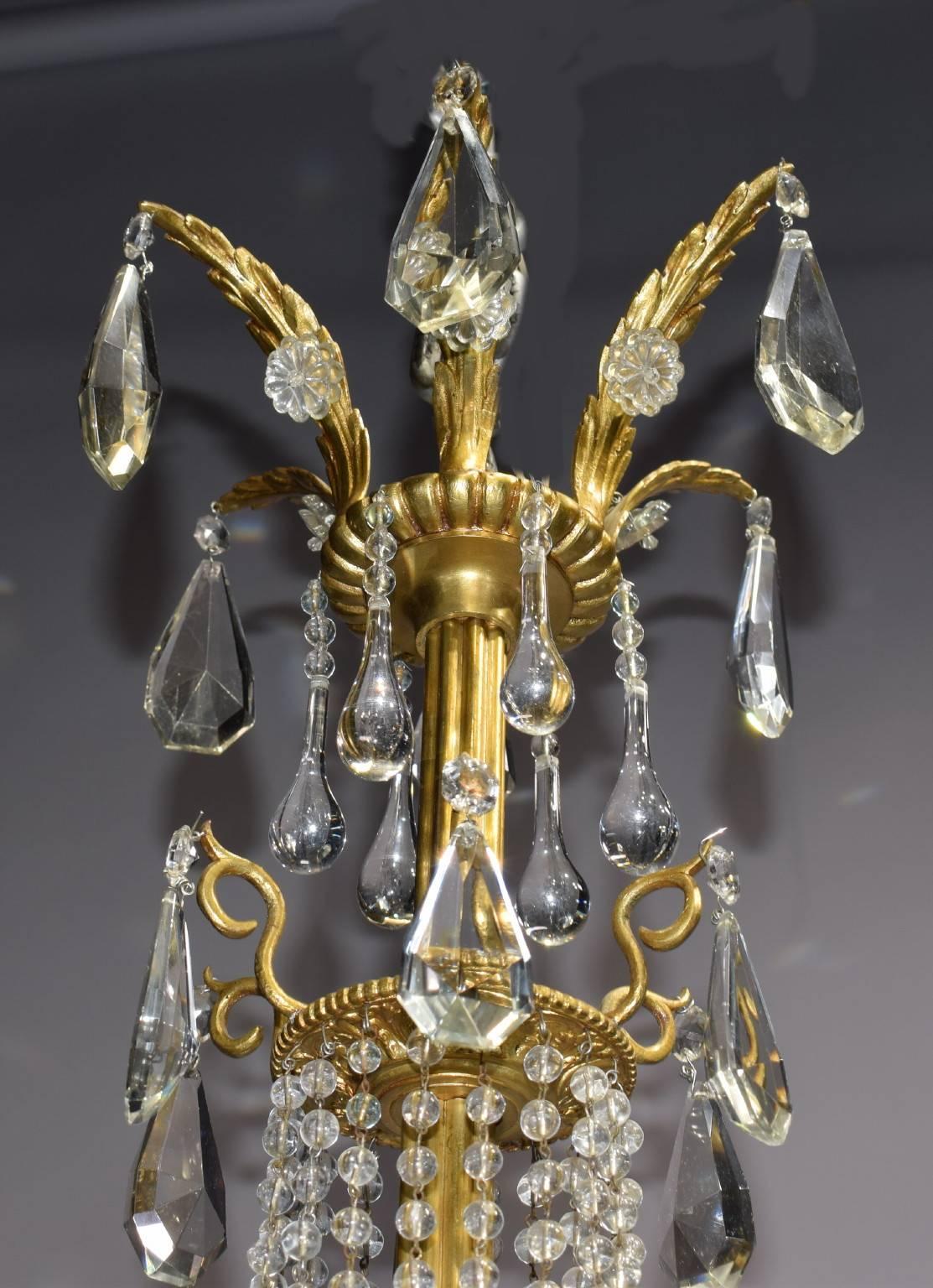 Gilt bronze and crystal basket style chandelier having six floral shades.