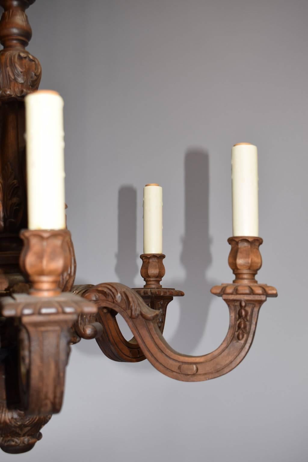 French six-light hand-carved wood chandelier.