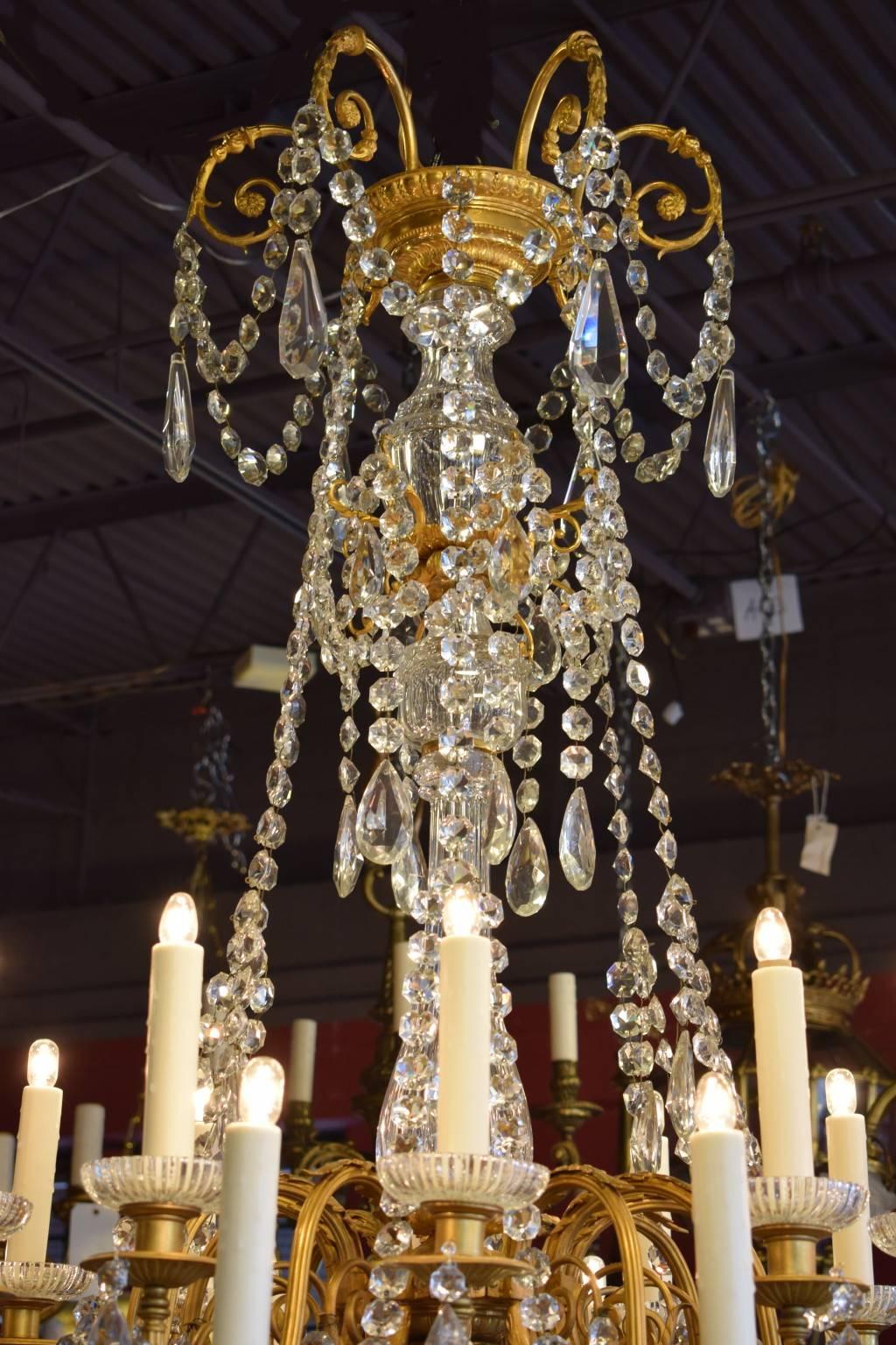 Superb gilt bronze chandelier with hand-cut centerpieces, crystals and swags.