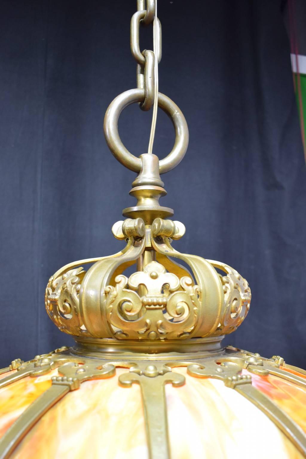 Very fine gilt bronze and slag glass hanging lamp attributed to Duffner and Kimberly. This firm made these types of lamps for a very short period in the early 1900s. Six internal lights.
https://en.wikipedia.org/wiki/Duffner_and_Kimberly.