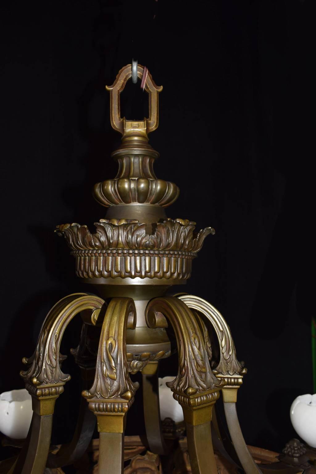 Exquisitely detailed chandelier of gilt bronze with alabaster dome and shades. Eight lights.