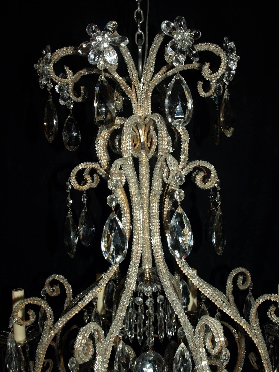 Unusual gilded iron and crystal eight light antique Venetian cage style chandelier