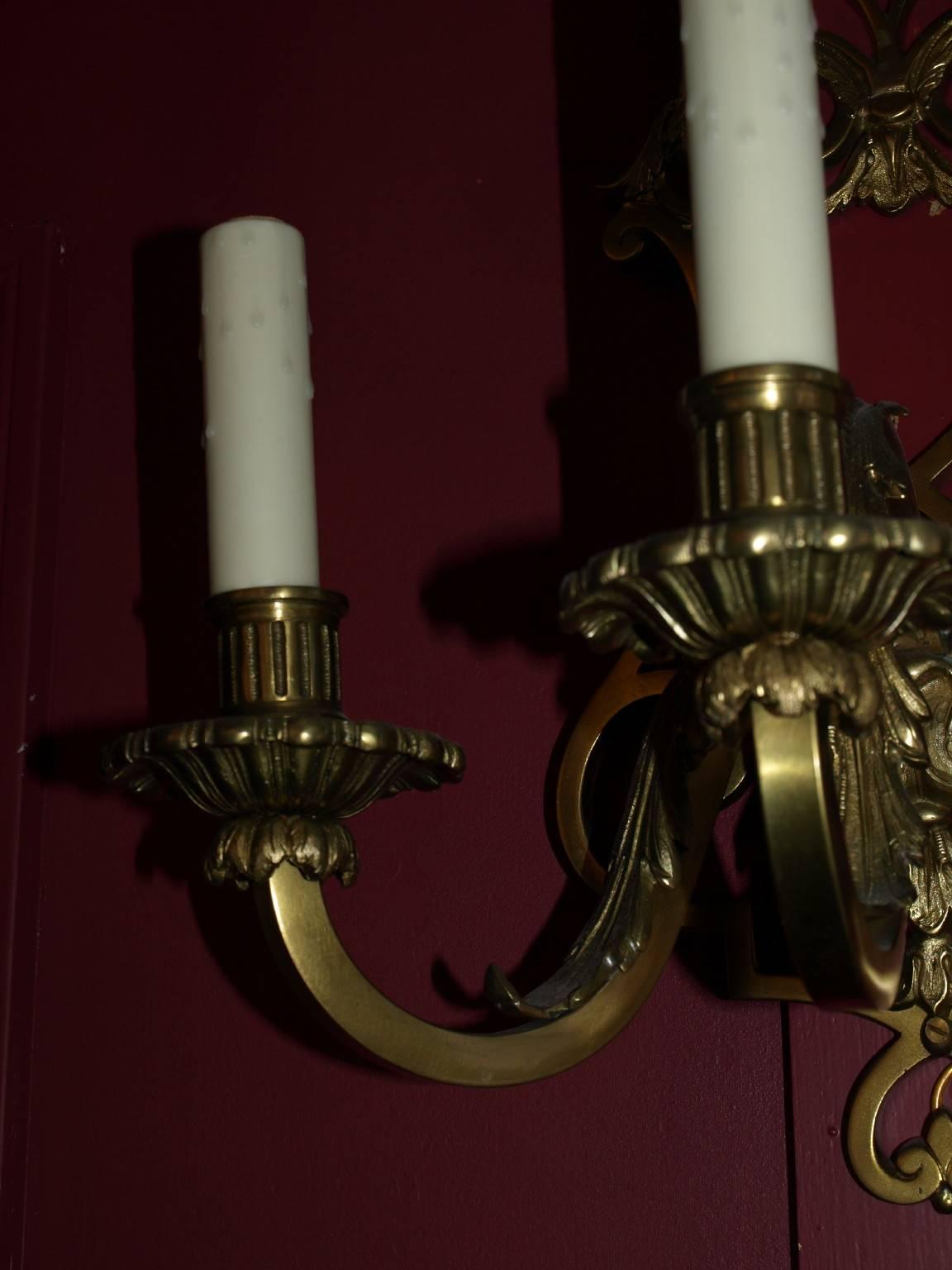 Pair of gilt bronze three light wall sconces, two pairs available