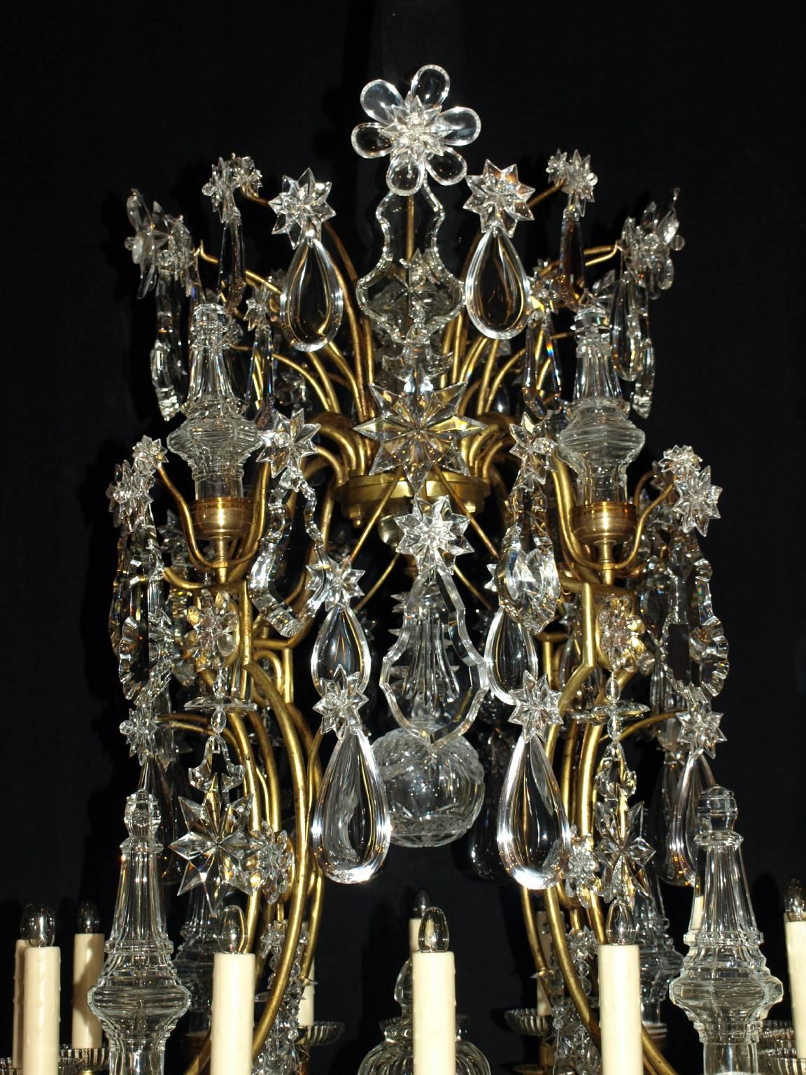A magnificent and imposing gilt bronze and crystal 12 light chandelier in the Louis XV 