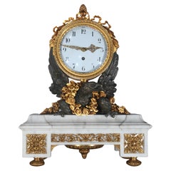 Orologio in bronzo dorato e patinato con aquila