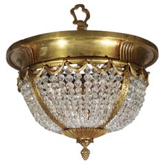 Ciondolo in bronzo dorato e cristallo