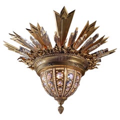 Uno squisito ciondolo/plafoniera in bronzo dorato e cristallo di Charles Blanc