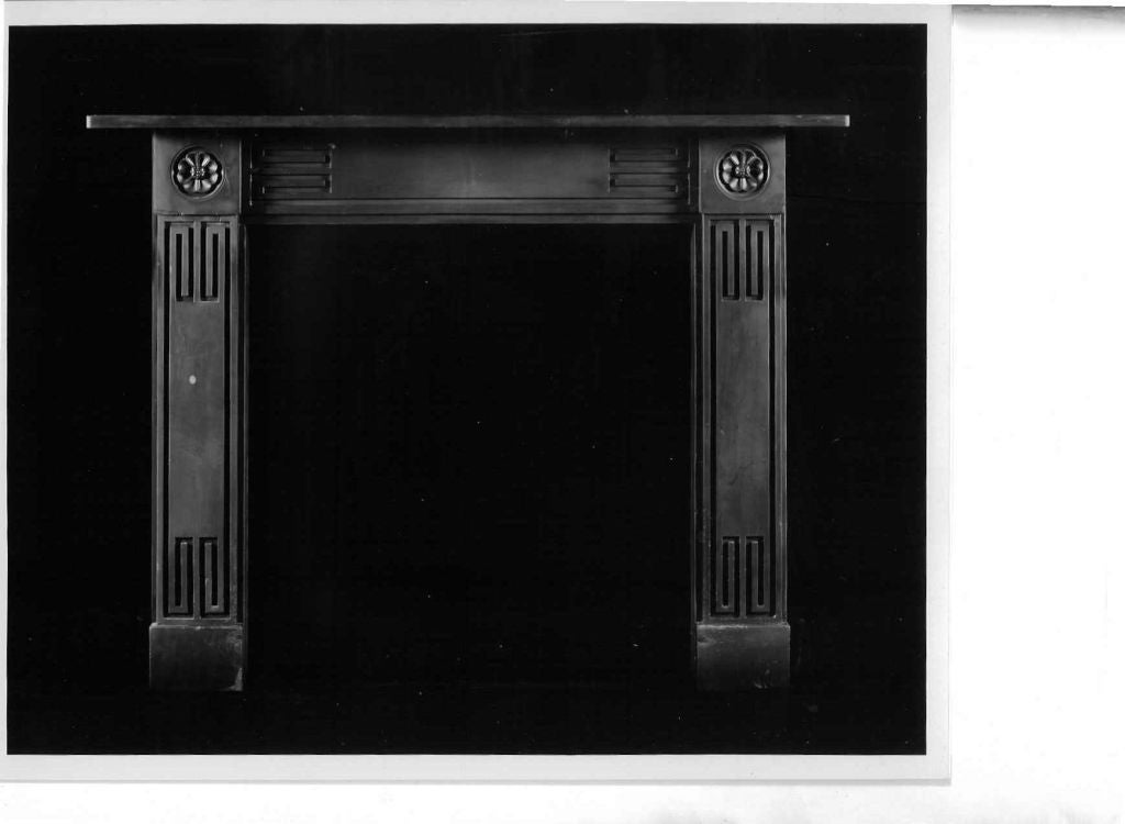 An unusual 19th century Welsh slate Regency “Greek-Revival” chimneypiece. The frieze and jambs are decorated with recessed Greek key motifs and the end-blocks with stiff leaf paterae, circa 1820.