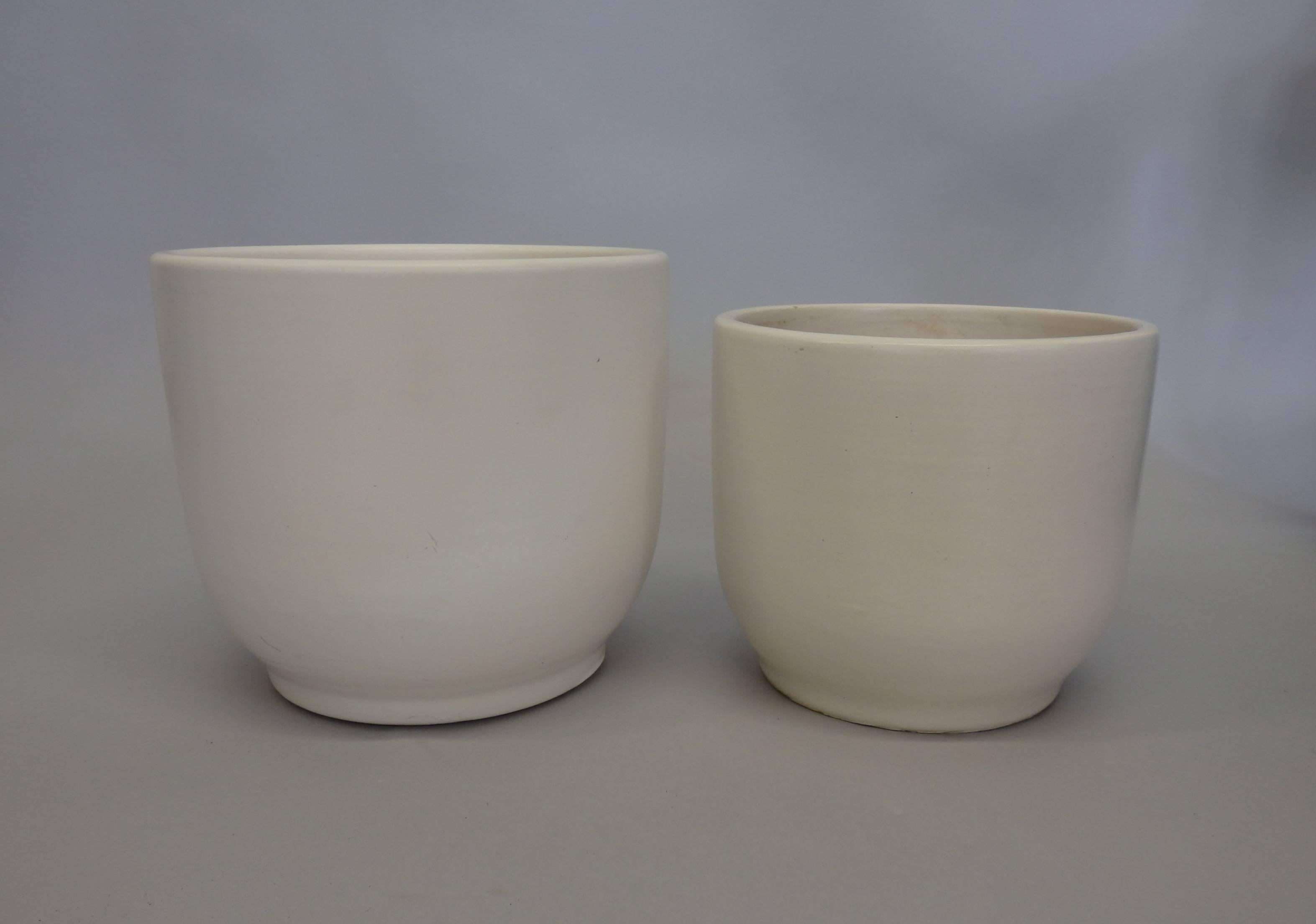 Previously used but not drilled. Excellent finish white no cracks or chips. Interior shows use.
Larger pot is 7.75 tall with 8.75 diameter . Smaller pot has 7.5 diameter at 6.5 tall