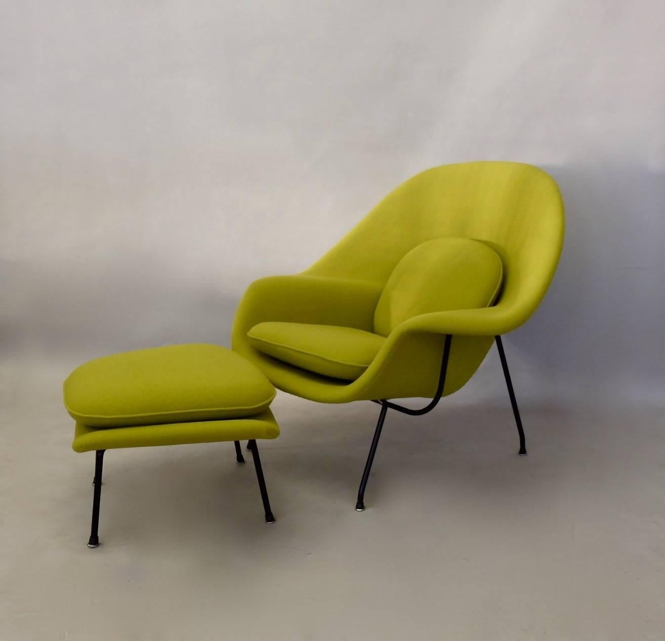 Properly restored genuine Knoll Eero Saarinen womb chair with ottoman. Early second generation black frame chair with slip on glides. Shell has been re-foamed and covered in period correct Maharam Kvadrat textile. Seams are sewn as original and