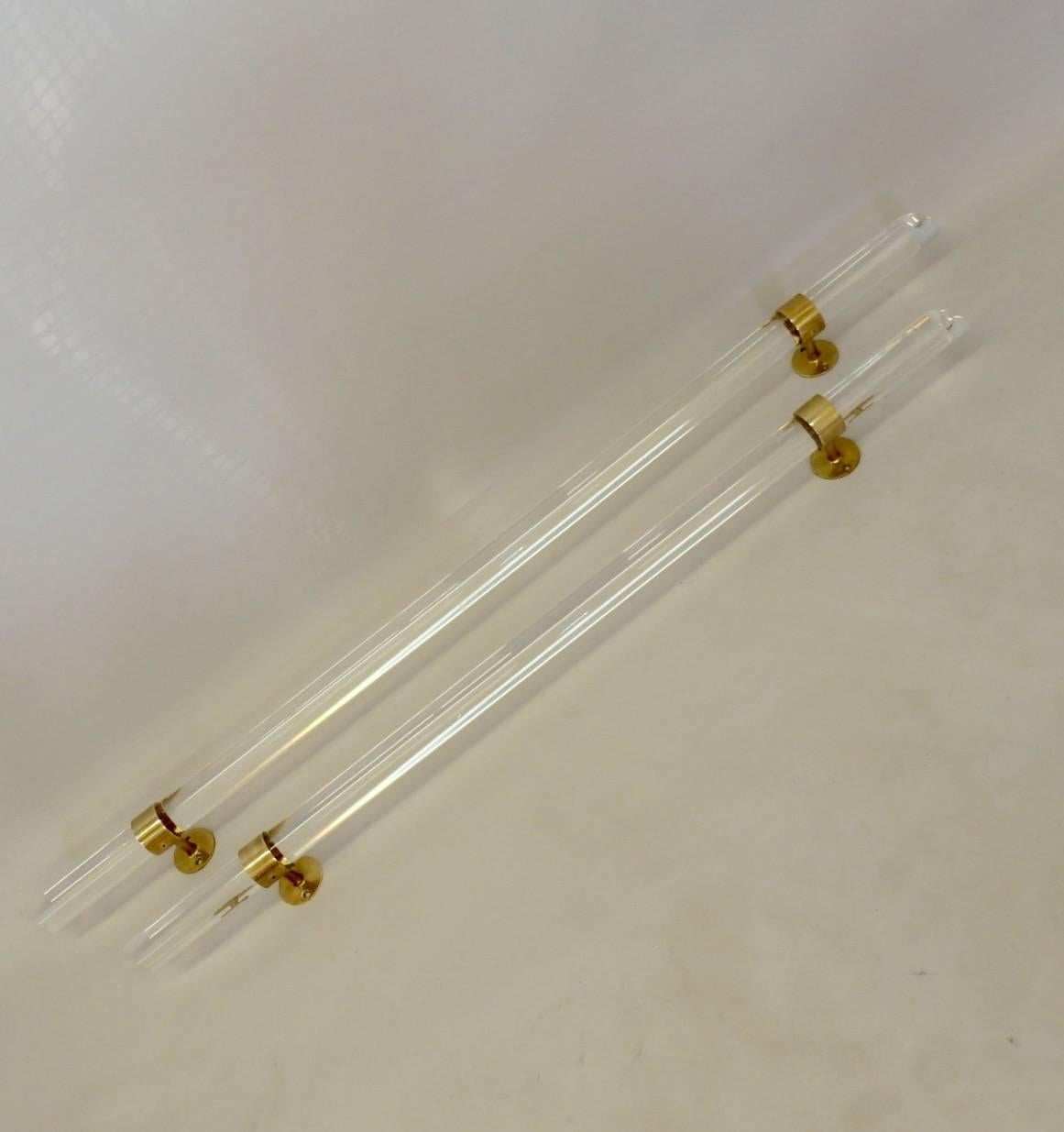 Pair of brass-mounted Lucite rails. Measure: Two 2.25