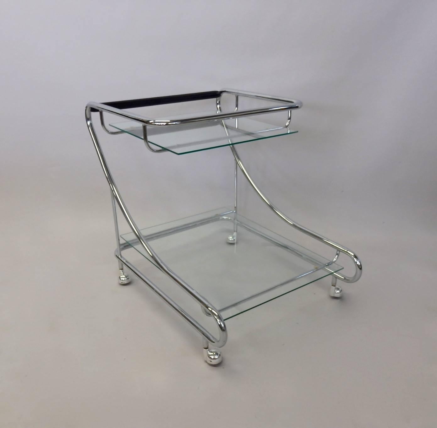 Very nice 1970s drinks cart. Upper and lower glass shelf in tubular chrome frame. Excellent condition all around.