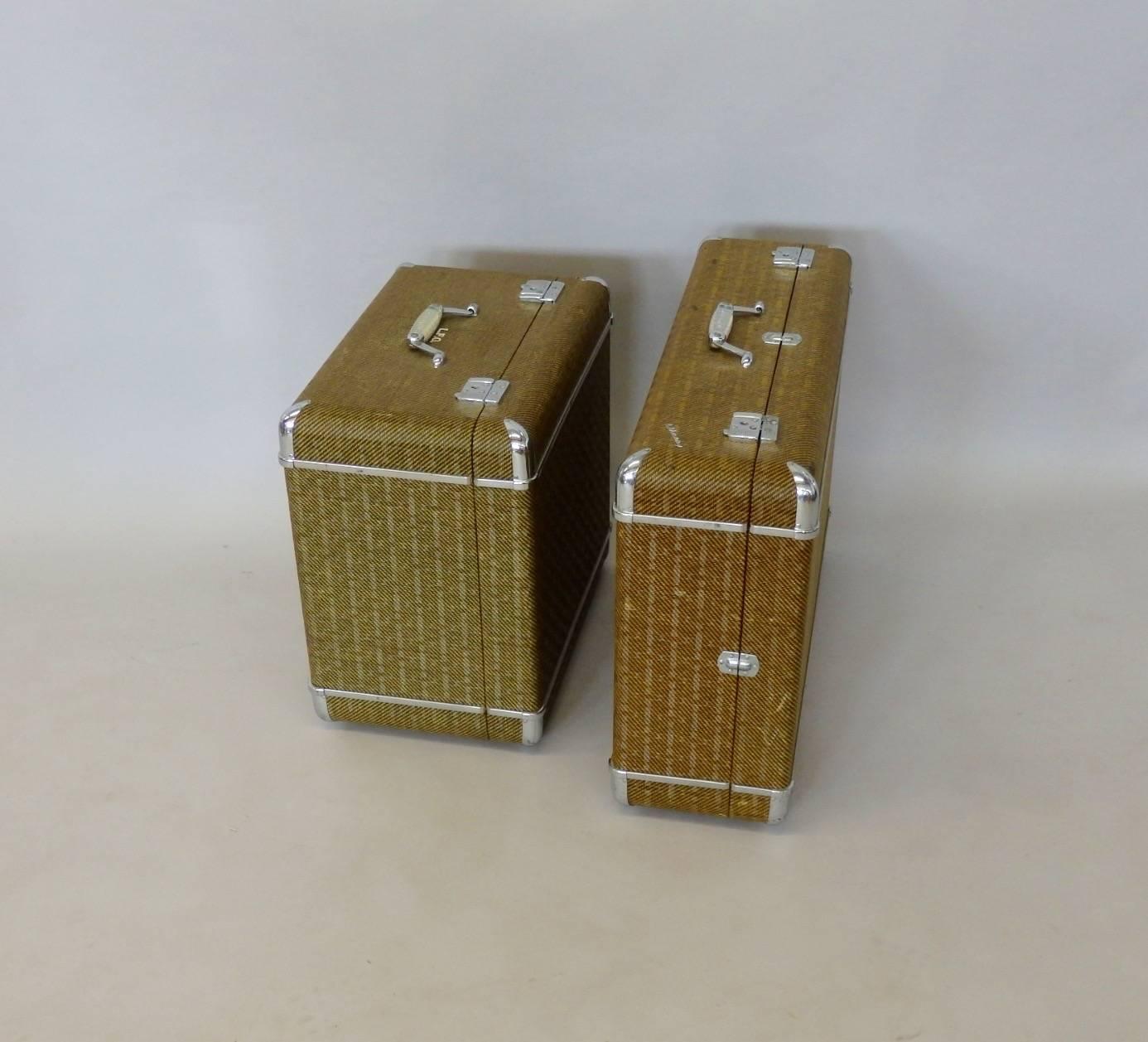 Pair of chrome trimmed Art Deco suitcases in excellent condition. Inside is immaculate chrome trim is excellent latches are in excellent working order. Mfrs label reads Wheary luggage Racine and new York. Metal tags from retail shop reads Bell
