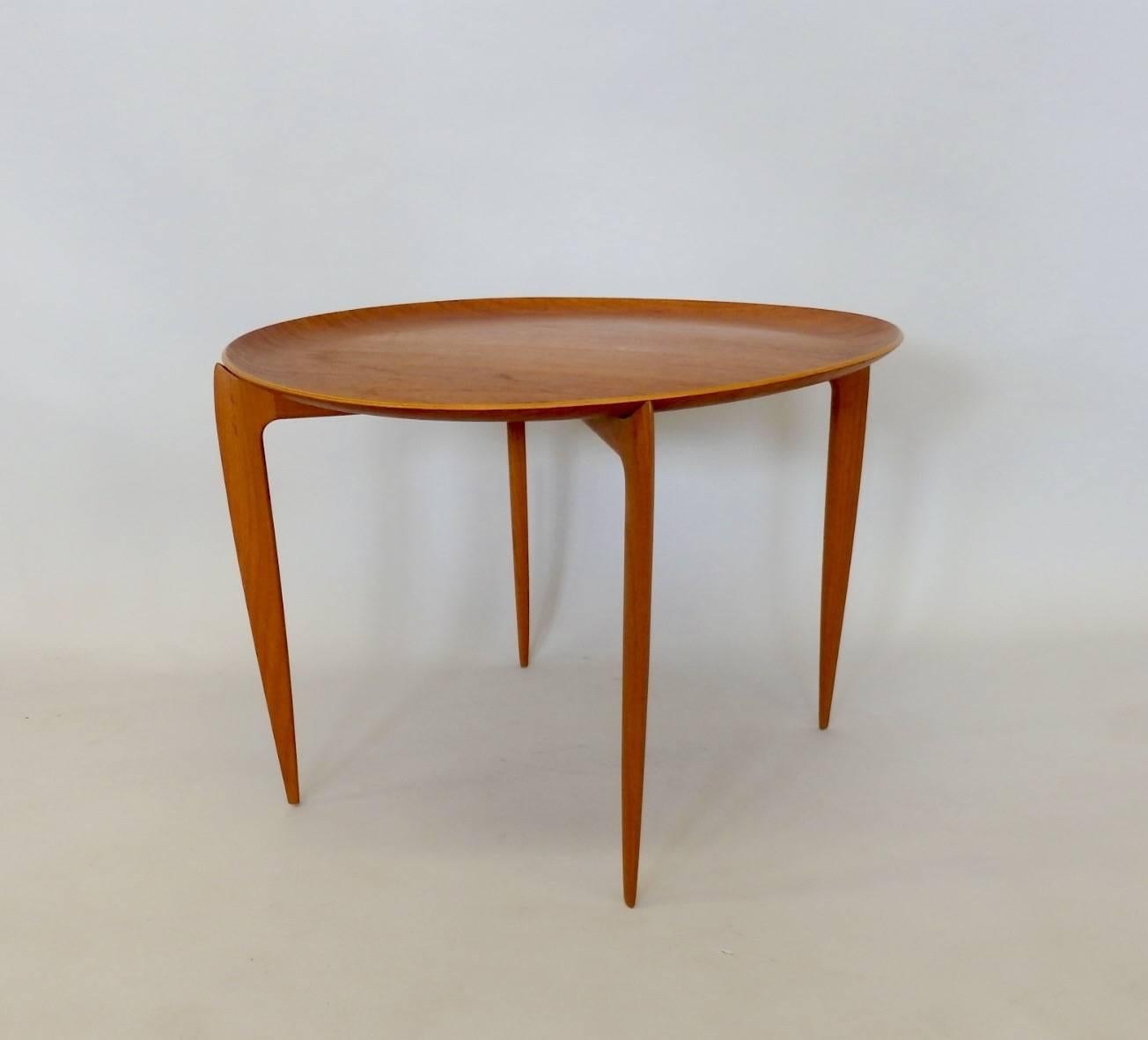 Willumsen and Engholm fold up base tray table for Fritz Hansen. Very nice original condition. Base is solid teak removable tray top is teak laminate wood.