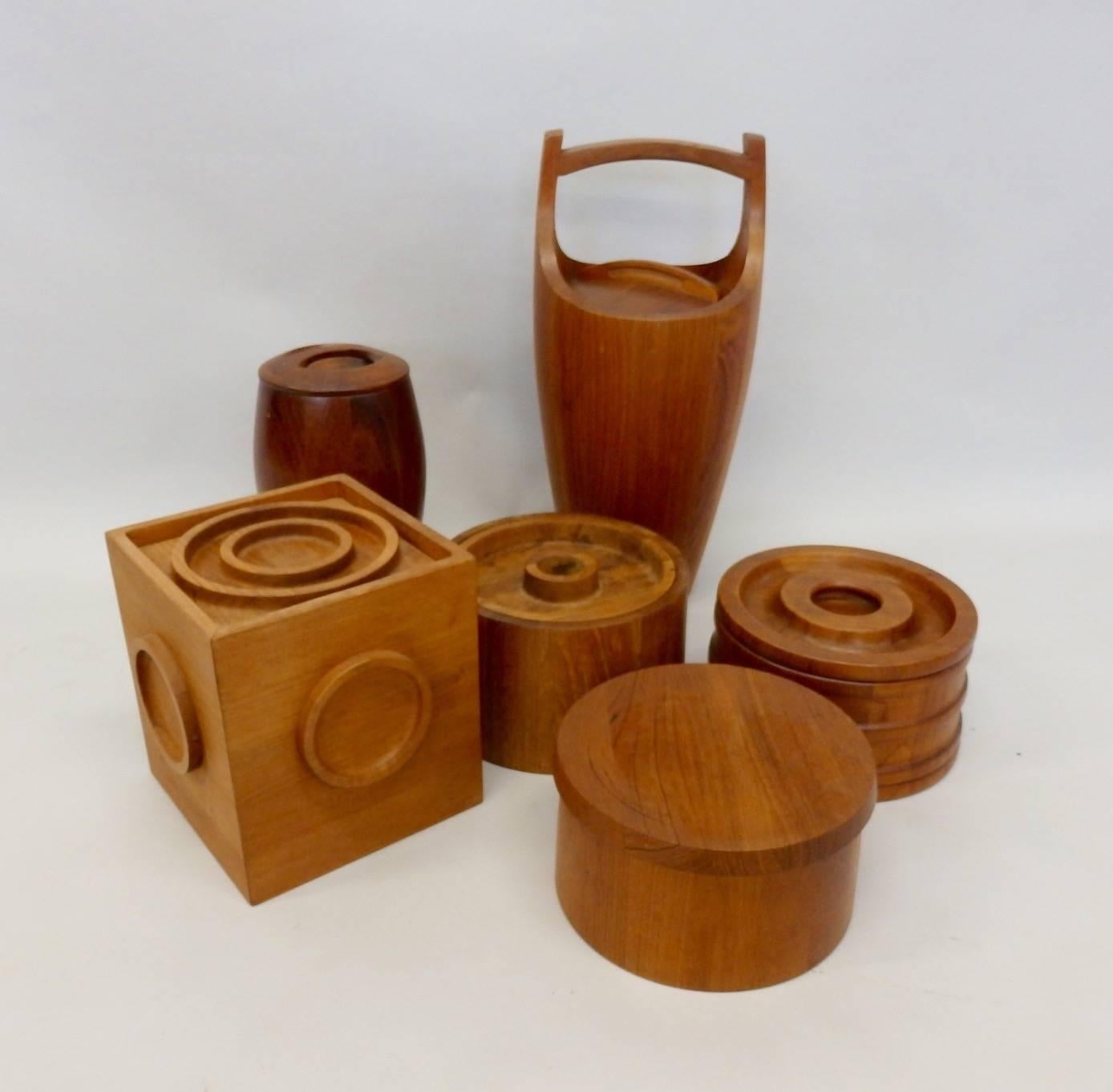 All five Danish teak ice buckets are Dansk designed by Jens Quistgaard. All five are made in Denmark. All five in very good condition age shows as patina.