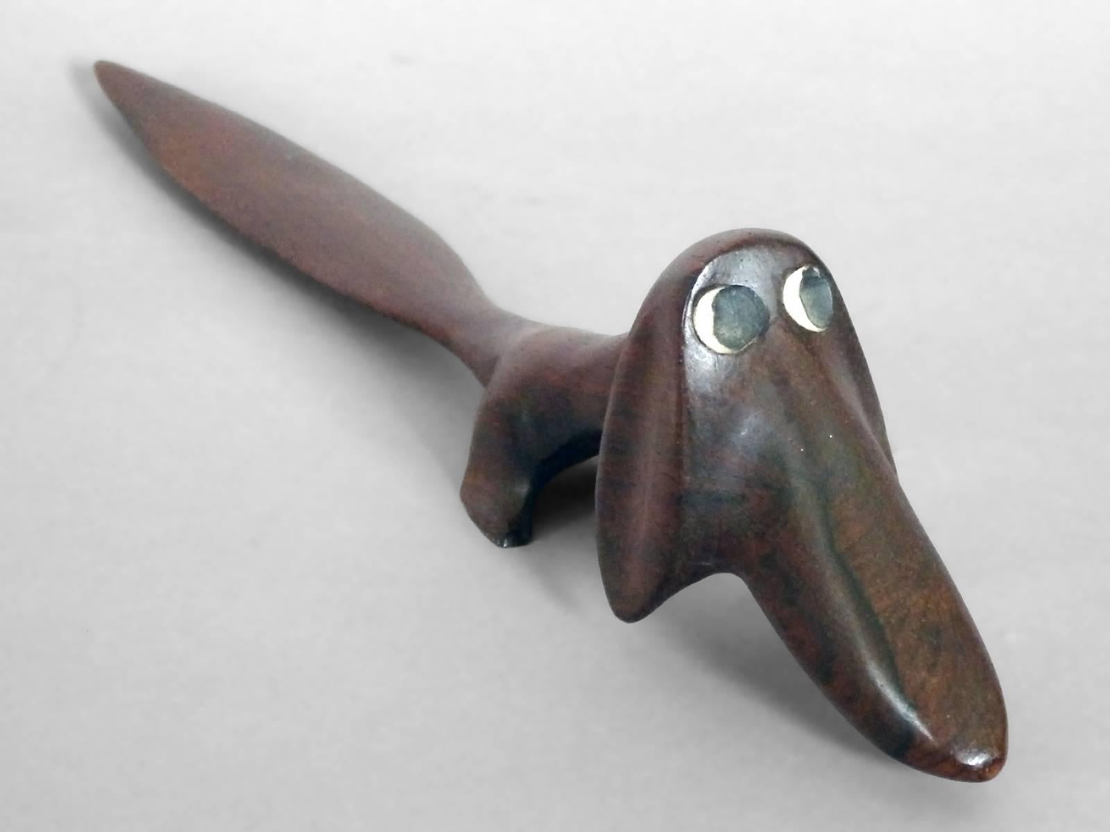 Nicely shaped and finished Rosewood letter opener . Hand carved in the form of a Dachshund Attributed to Illums Bolighus Denmark . 