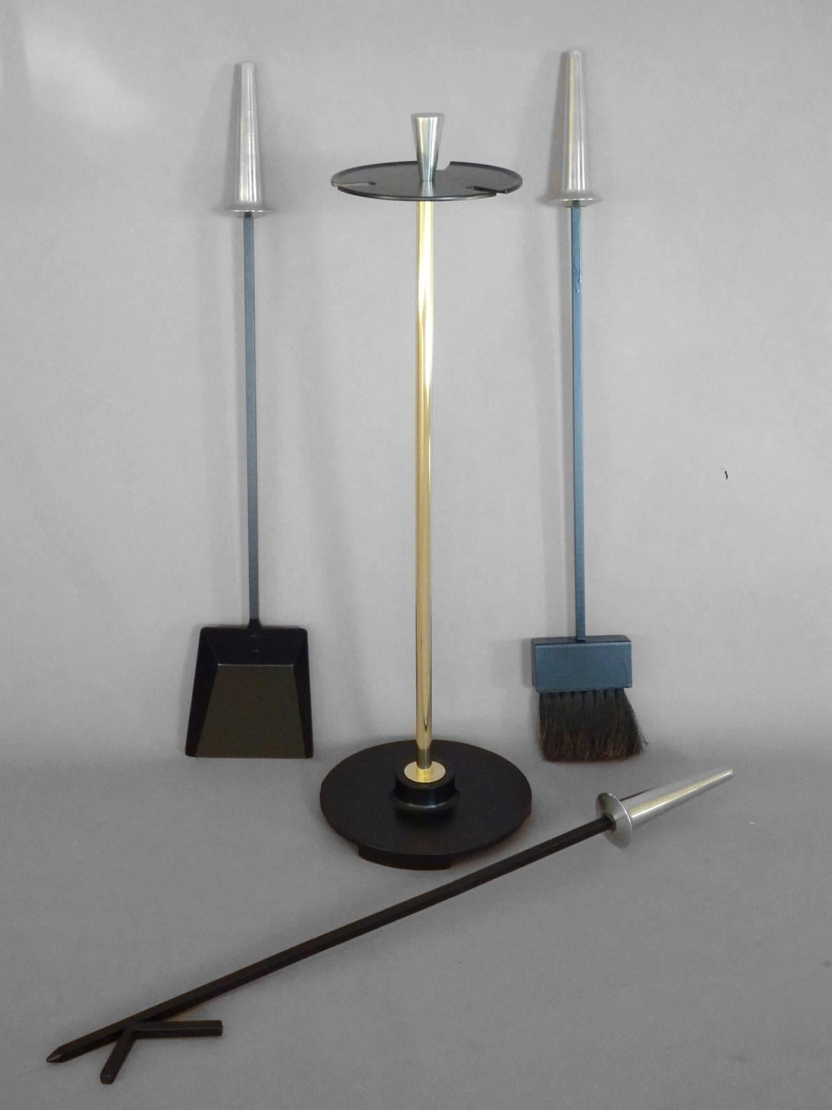 Set of Modernist fire tools attributed to the Pilgrim Company
Base: 8.5” diameter x 31” tall 
Each tool: 28.75