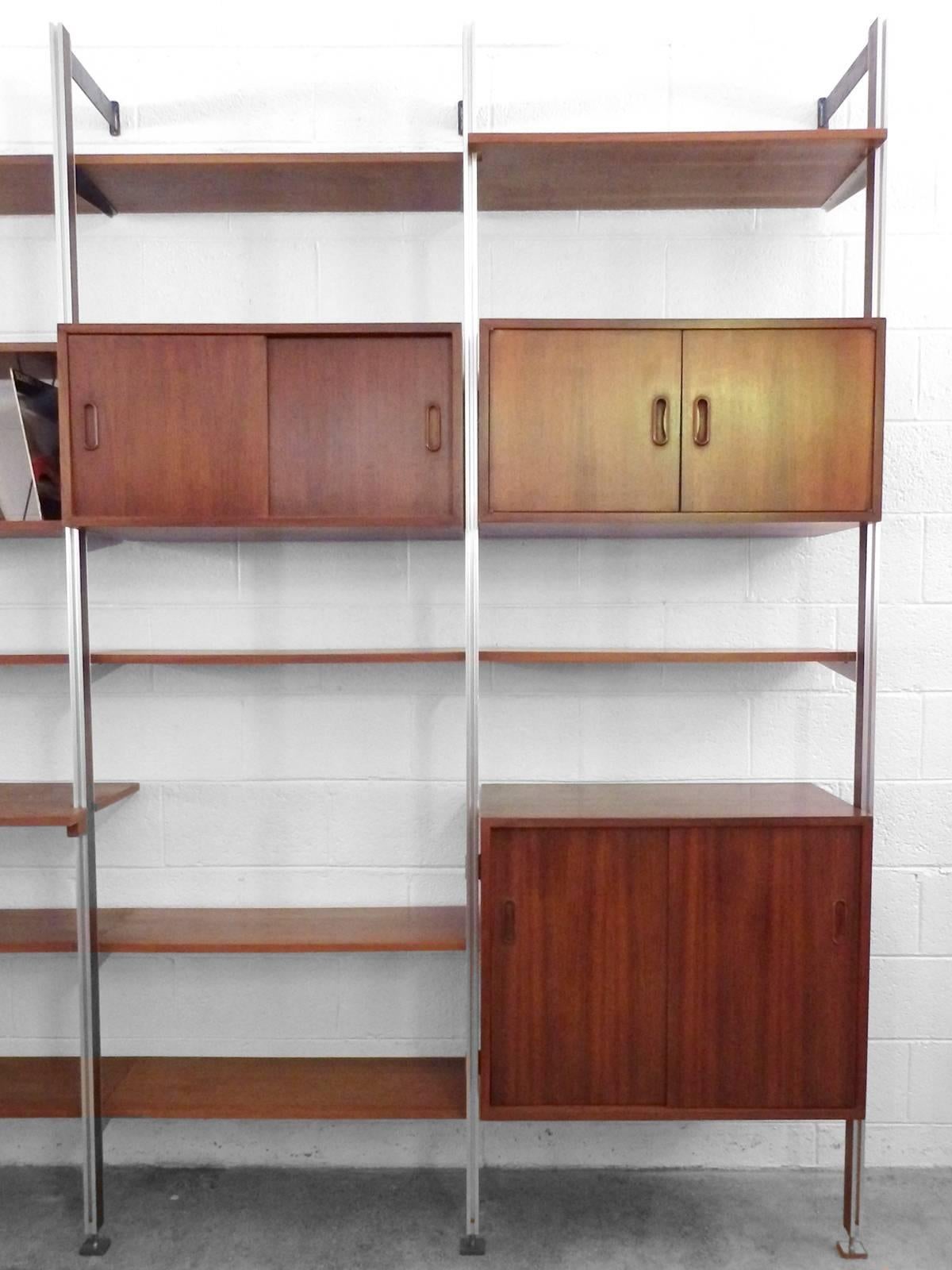 George Nelson for Omni
Cabinets: 18 deep, shelves: 12 deep.
Overall 129.5 wide - 98 tall - 18 deep.