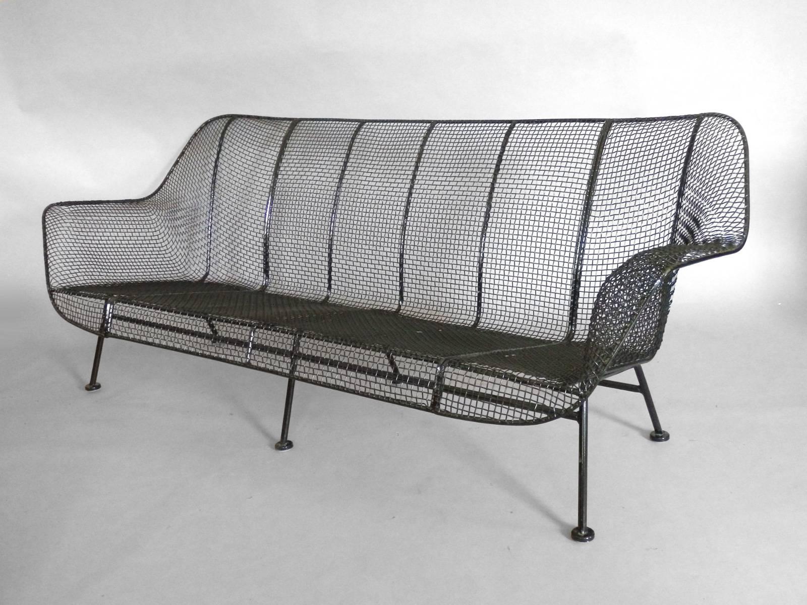 Wrought iron couch by Russell Lee Woodard for Woodard. Freshly powder coated in gloss black with new glides added .  The best 