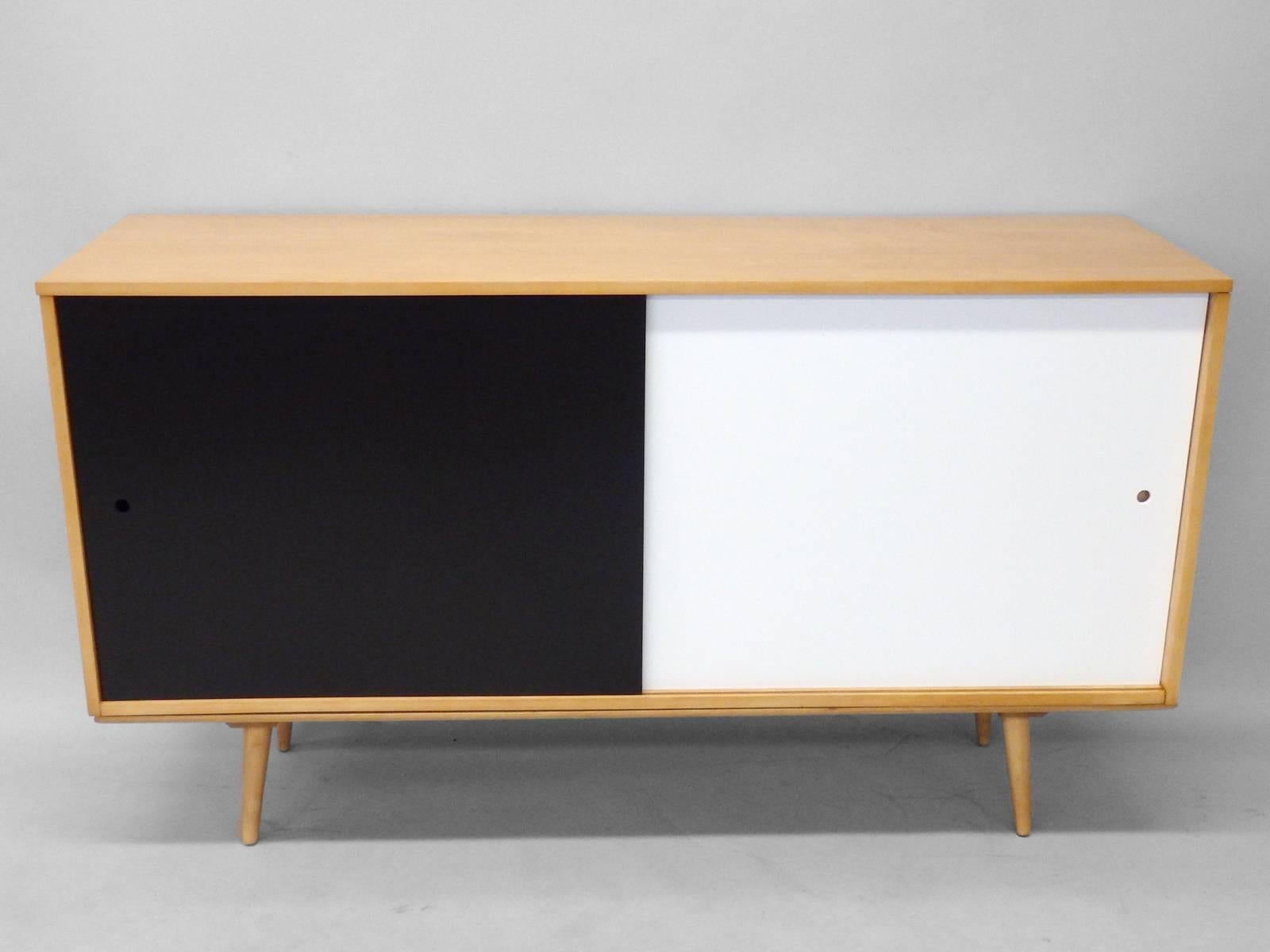 Sliding door cabinet by Paul McCobb for Winchedon.