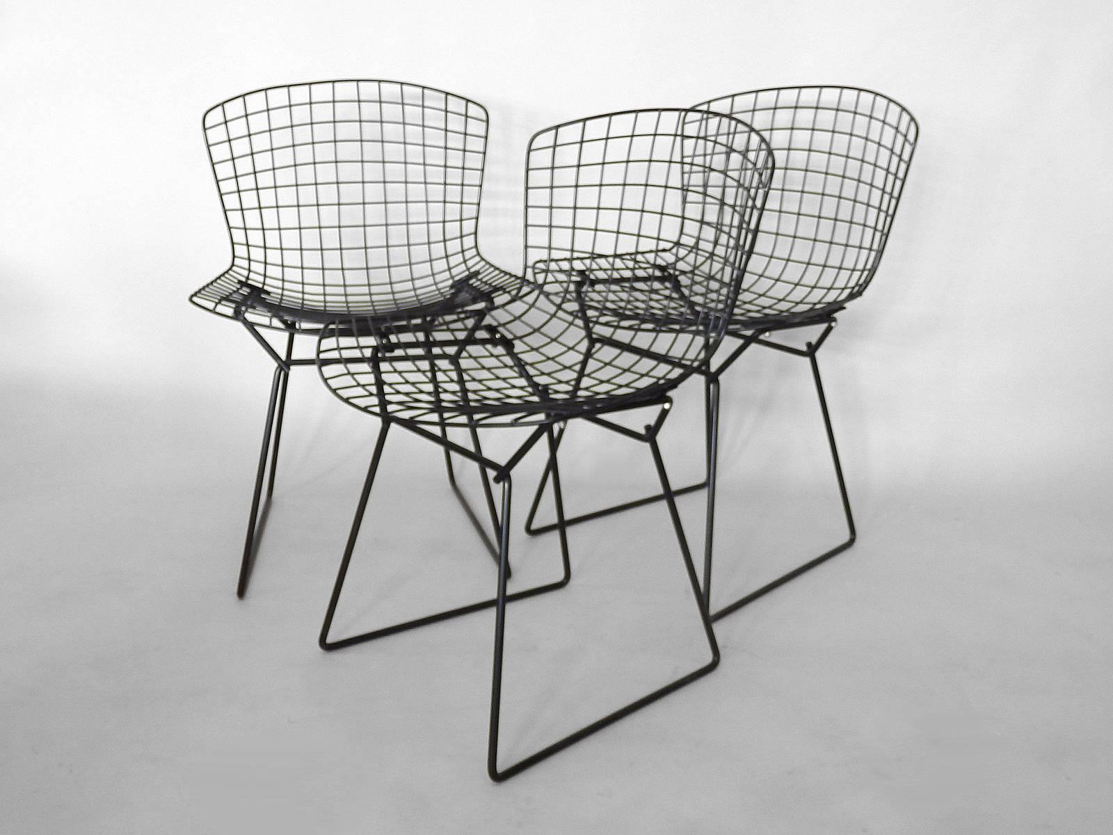 Harry Bertoia for Knoll black wire dining chairs.