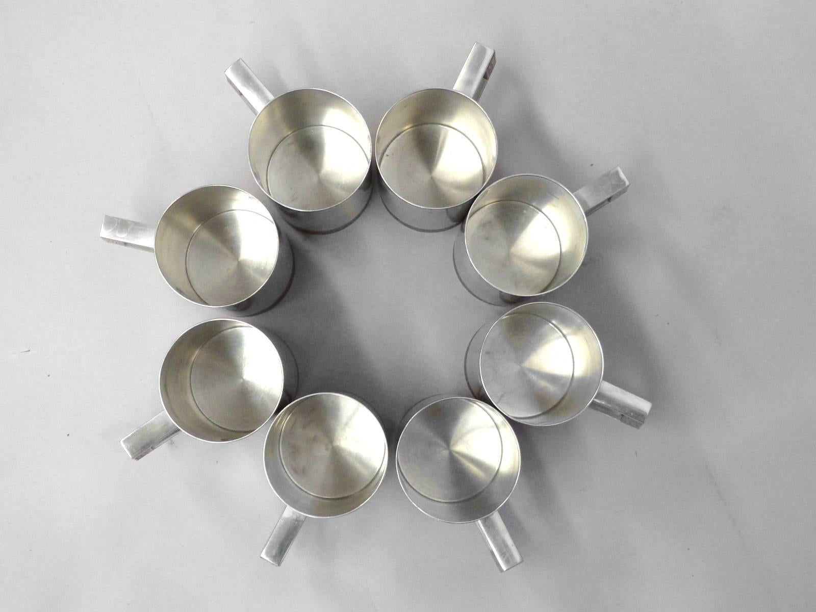 Eight modernist Pewter with teak cups or mugs. Attributed to Jens Quistgaard for Dansk Designs. Perfect for Mocow Mules cocktail .
