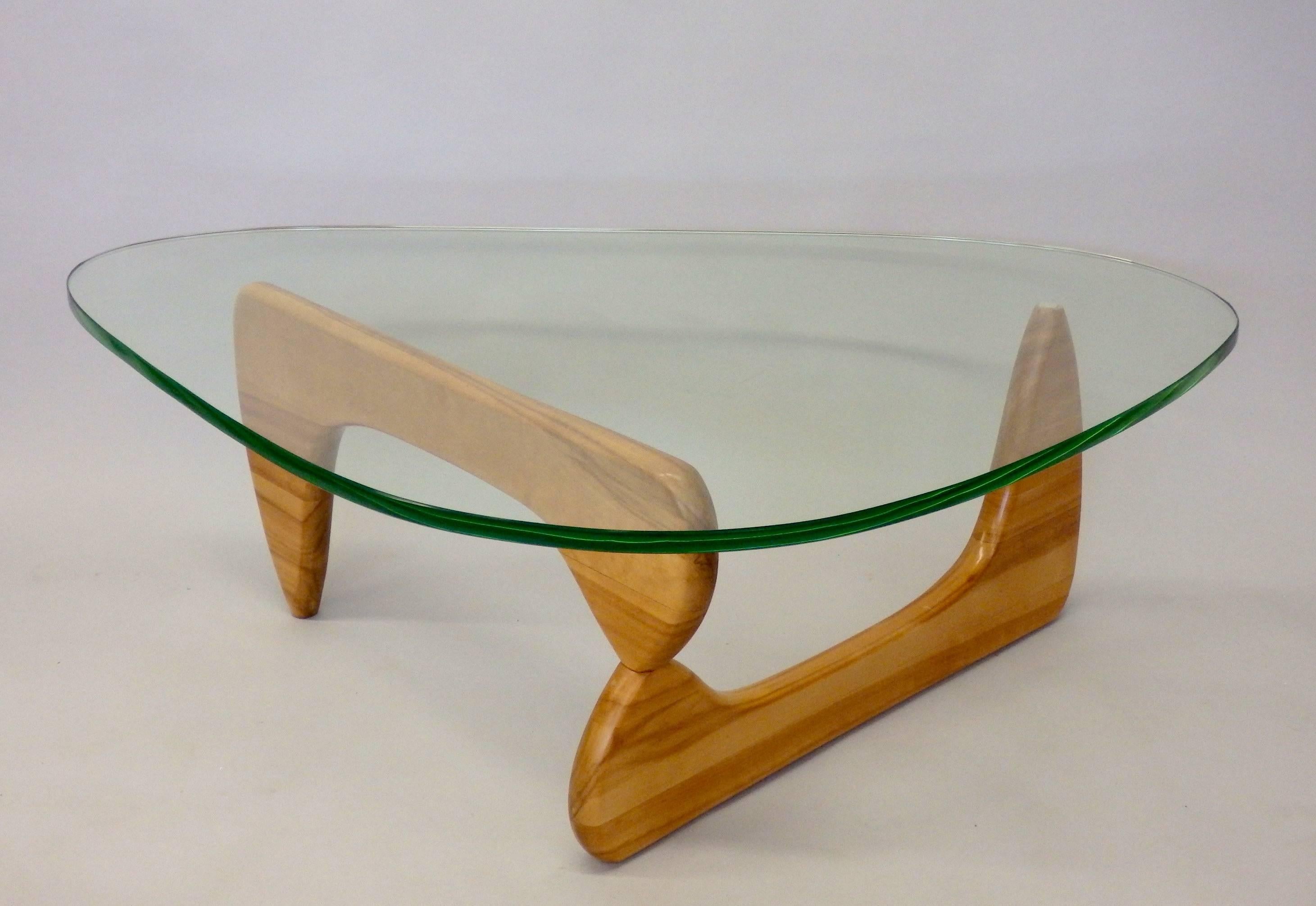 Finest example of early production Noguchi for Herman Miller coffee or cocktail table. Original light green edge glass top in fine condition. Birch base has been refinished.