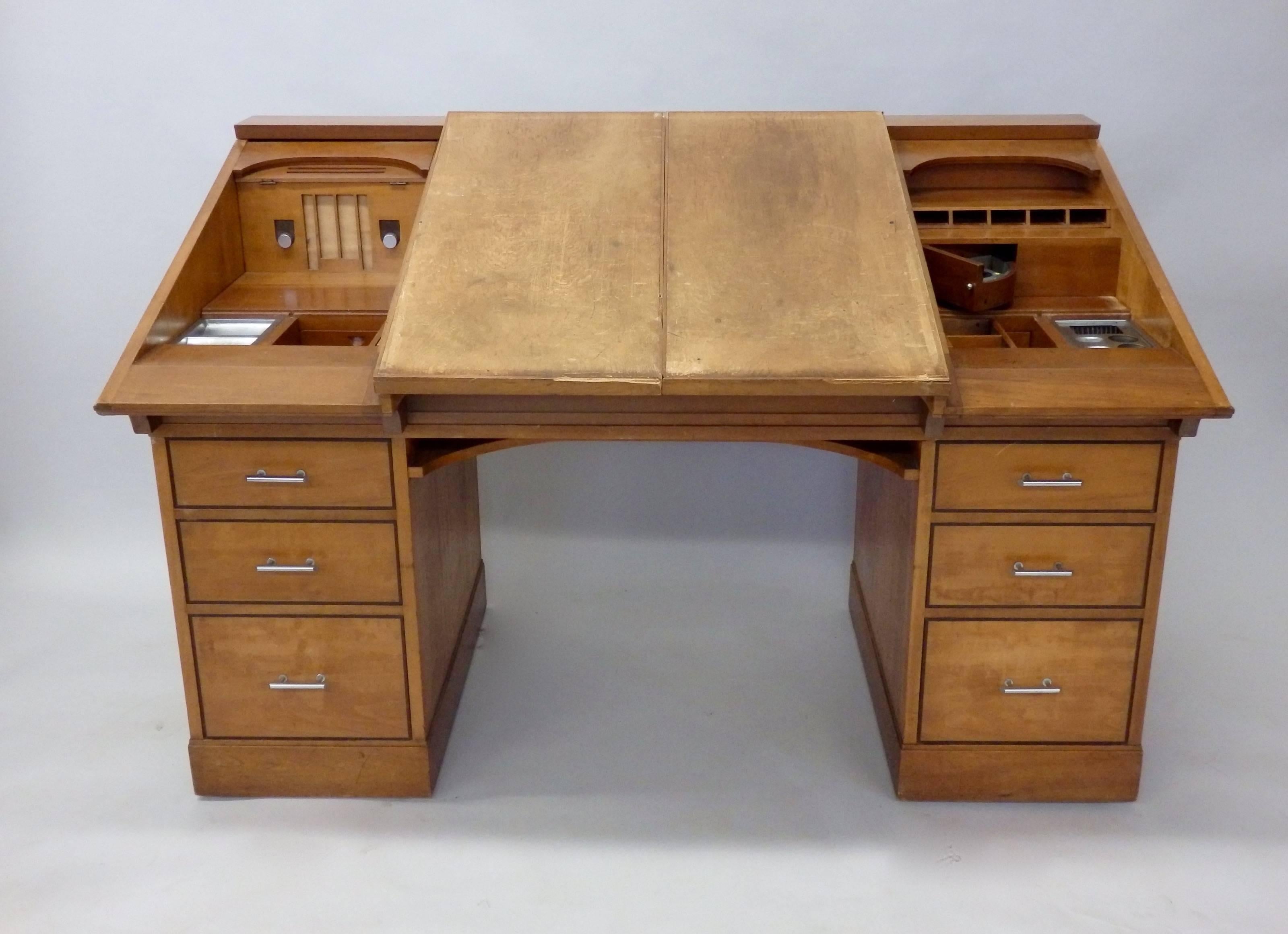 Custom Built Art Deco desk attributed to Johann Tapp of Chicago . Built for Chicago Tribune Pulitzer prize winning cartoonist Carey Orr. Both top side panels flip inward to create drafting workspace. Sliding doors reveal multiple compartments