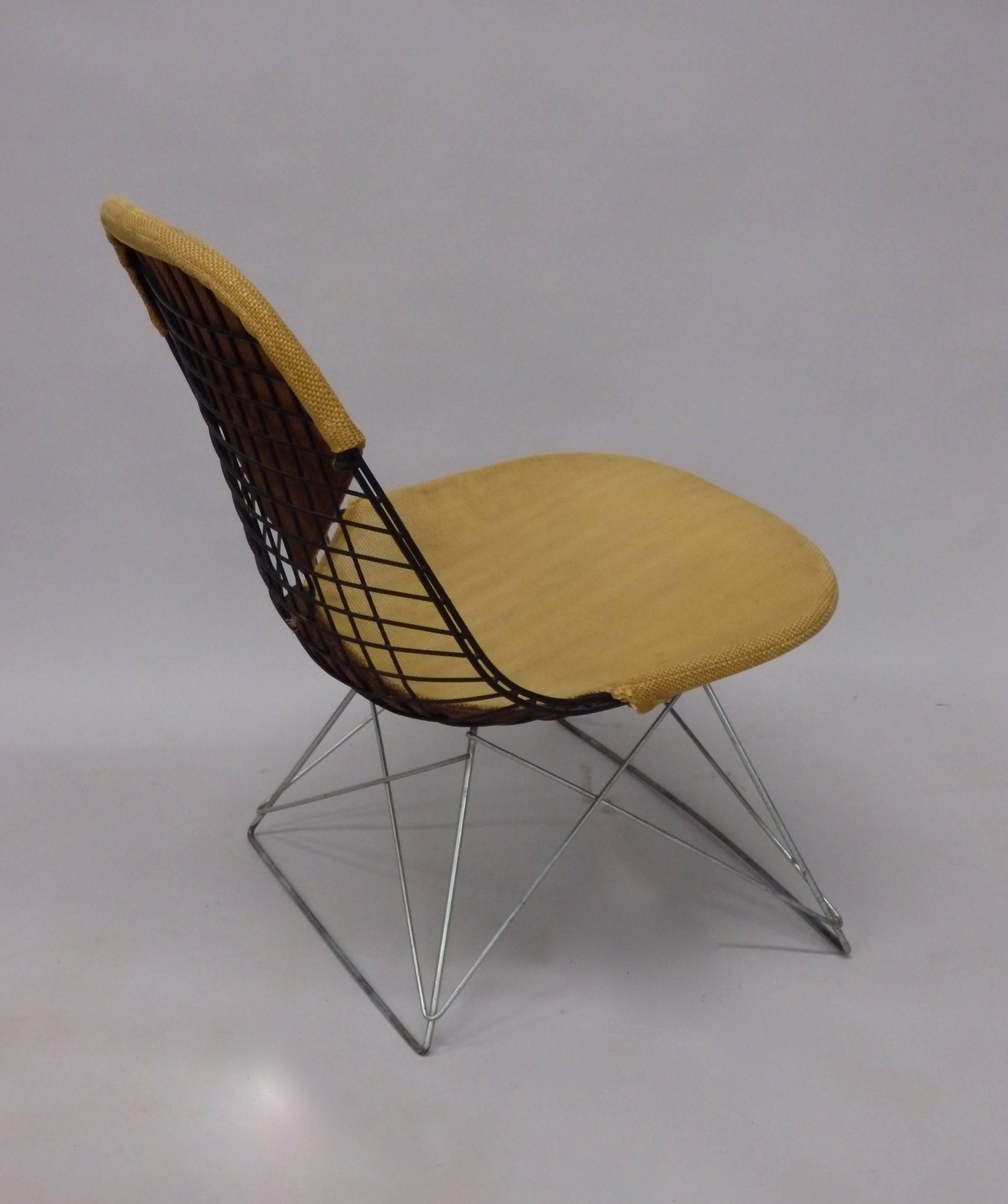 Very nice black wire frame chair on zinc cat’s cradle low base. Early chair with original cover all in very nice as found untouched condition. No repairs or broken welds. Herman Miller Venice Ca. label intact.