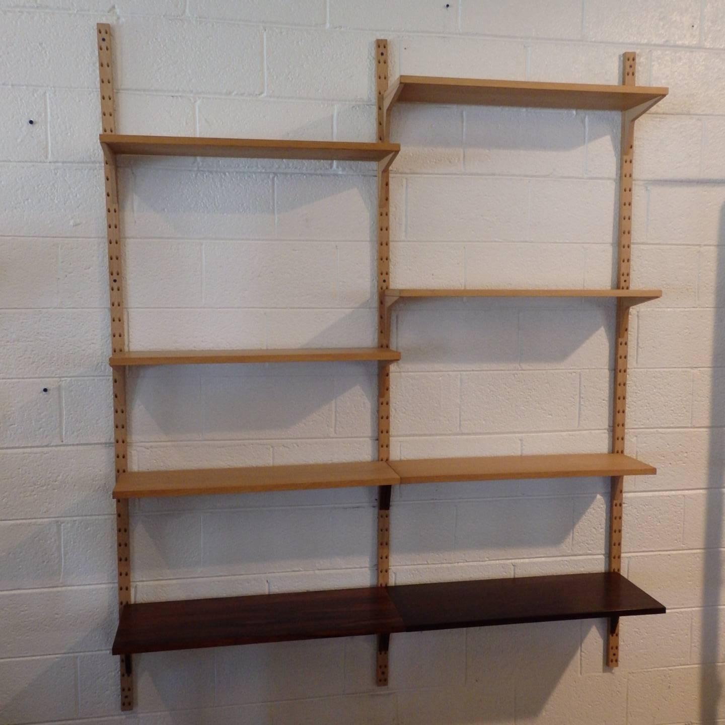 Very nice Cado system all pieces were pulled from the original boxes. Two lower shelves are palisander. Smaller top shelves are white oak. Up rights are white oak. All excellent.