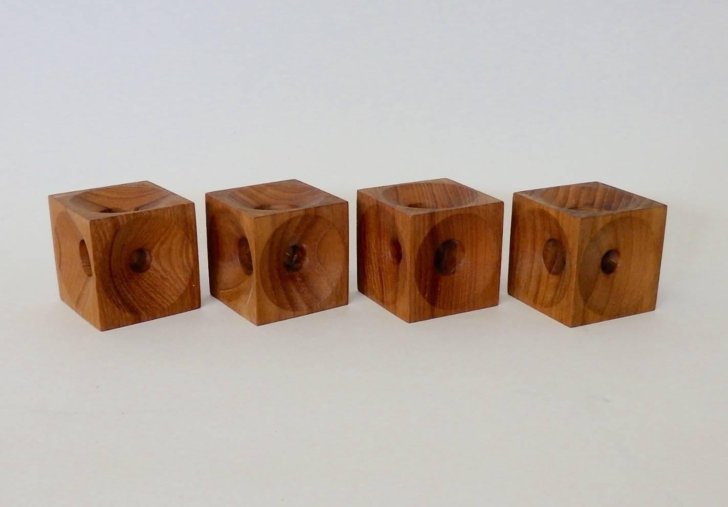 Nicely crafted solid Teak candle stands. Each side of each cube has a different diameter hole for use with varying candle sizes. Well marked E.H. Denmark on each piece.