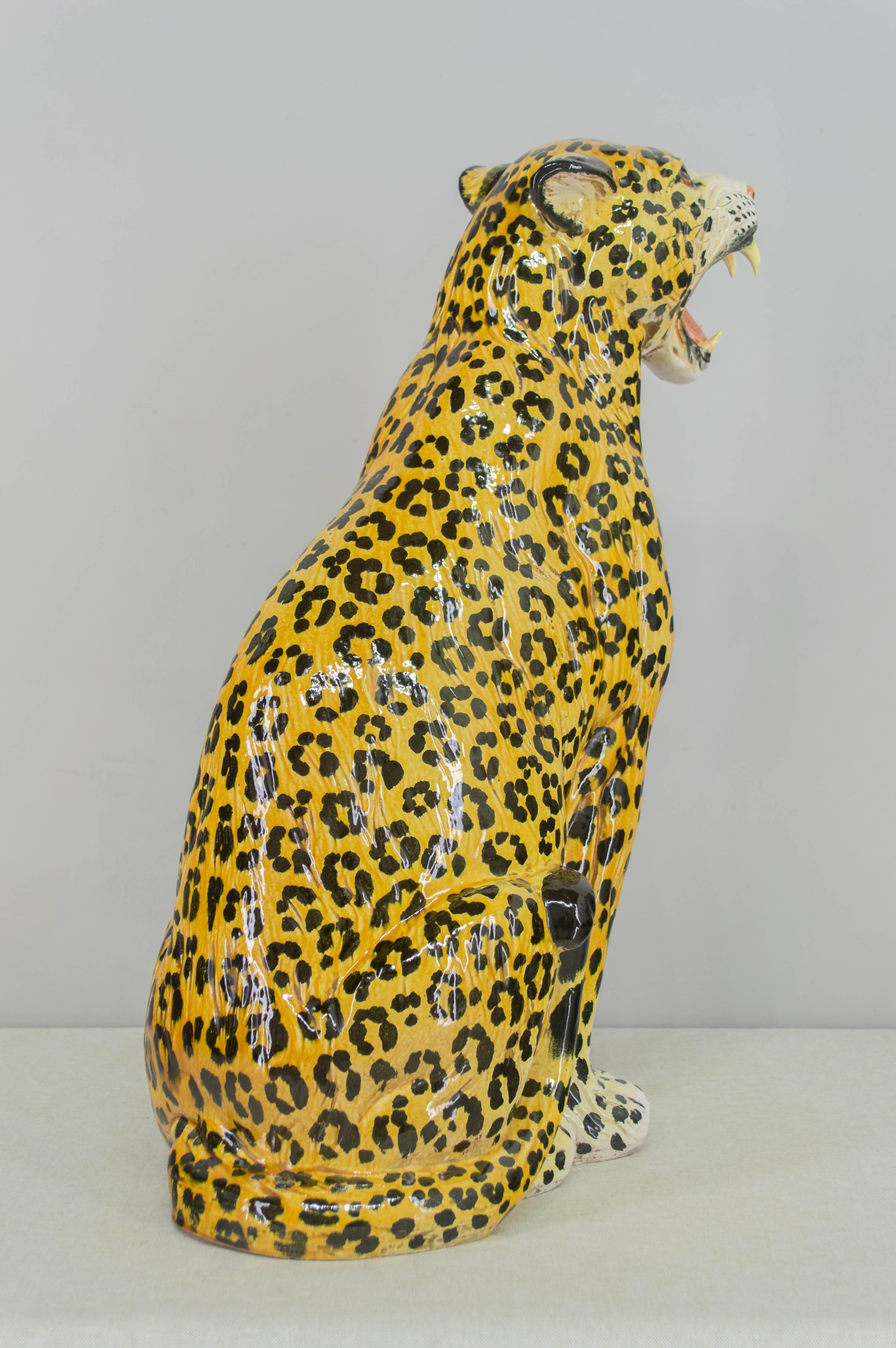 Italian glazed terra-cotta leopard, finely crafted with life like features, especially in the cat's face. Stamped underneath: Made in Italy. Weight is 22 Lbs. 
