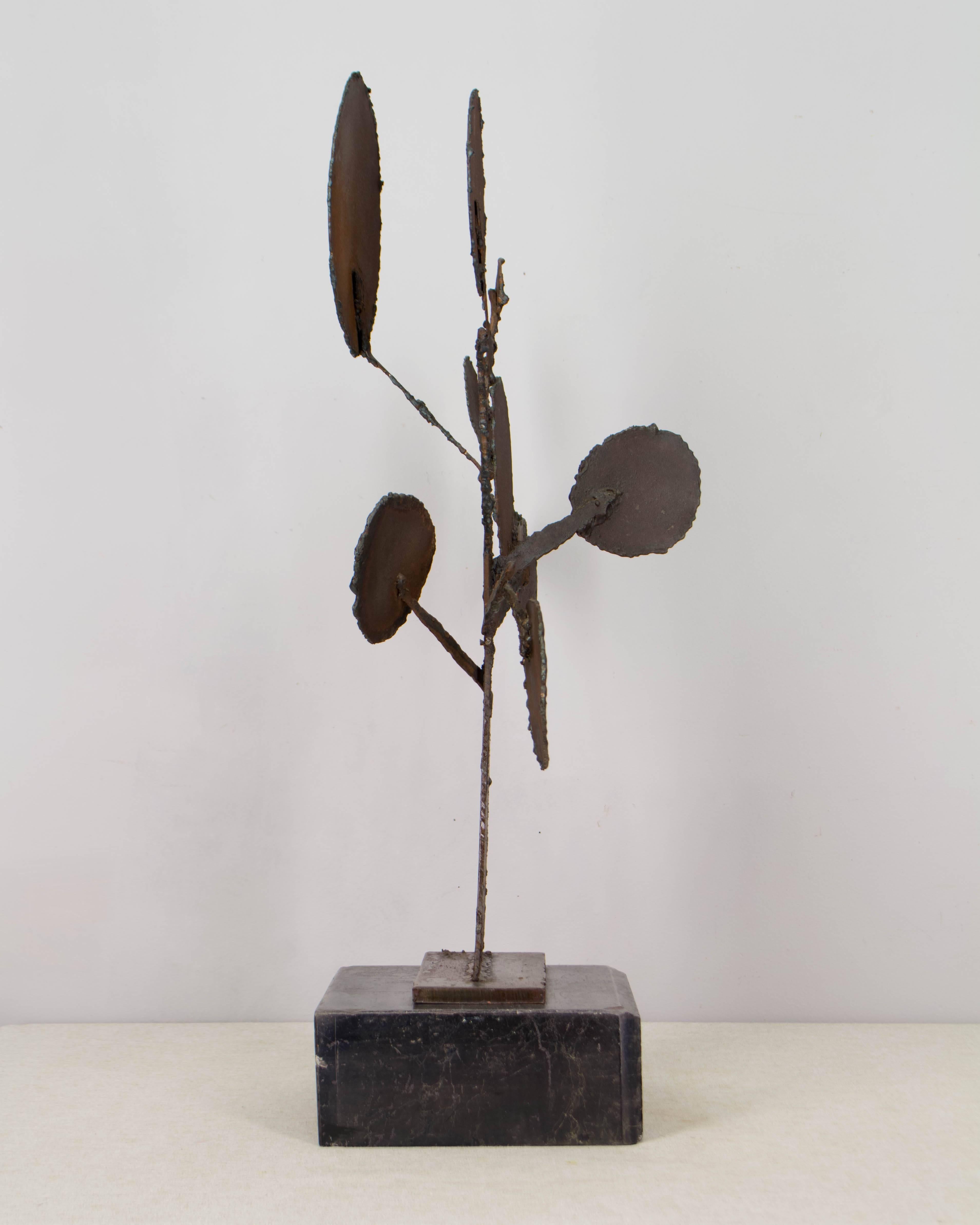 Mid-Century Modern Brutalist tree sculpture. Torch-cut and welded steel with rusty, bronze colored patina. Bolted to a slate base.
More photos available upon request. We have a large selection of French antiques. Please visit our showroom in Winter