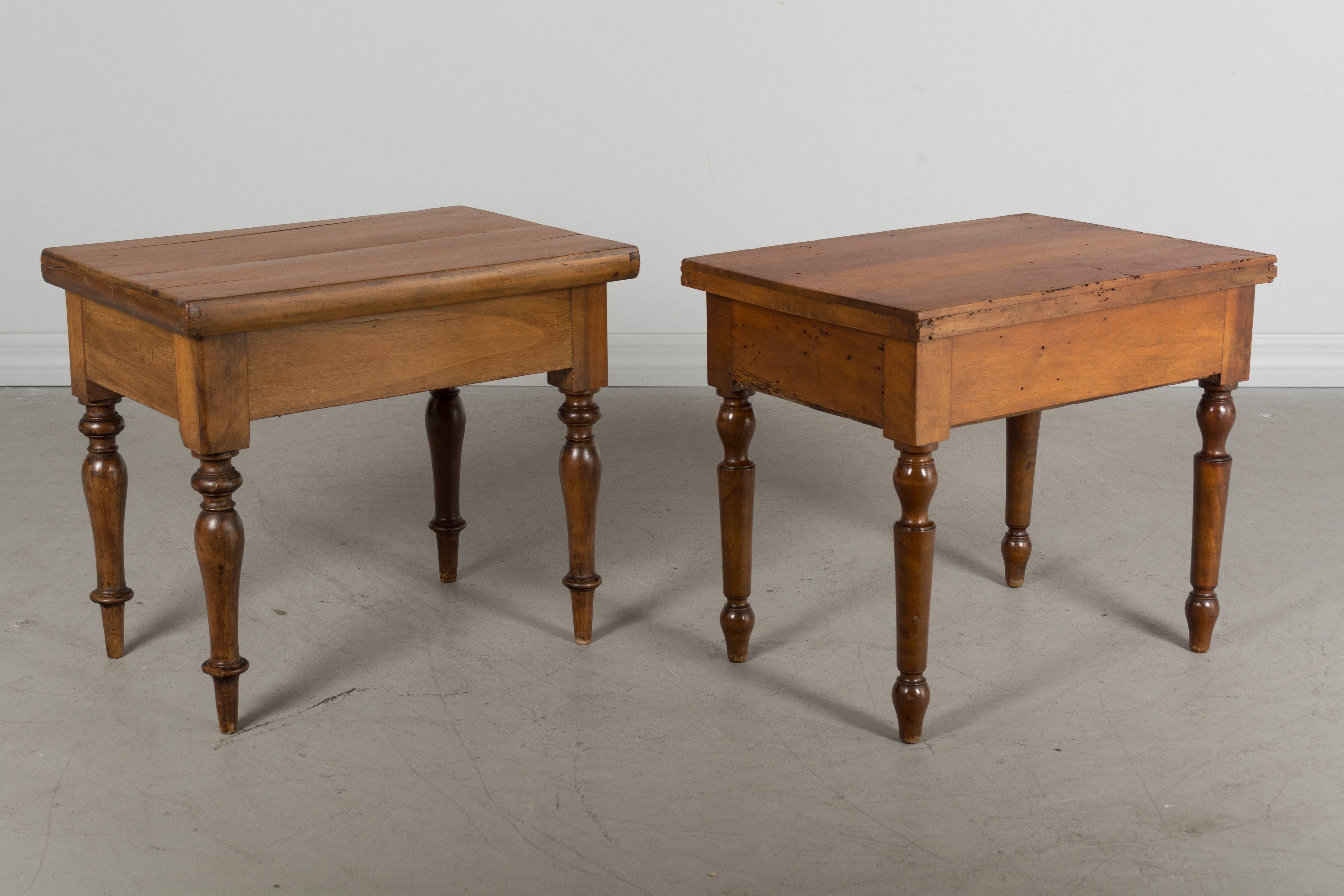 A pair of small French Louis Philippe tables with removable tops made of cherrywood. Originally these were children's potty chairs, having zinc interiors that would have held porcelain bowls. May be repurposed as planters or used as small tables or