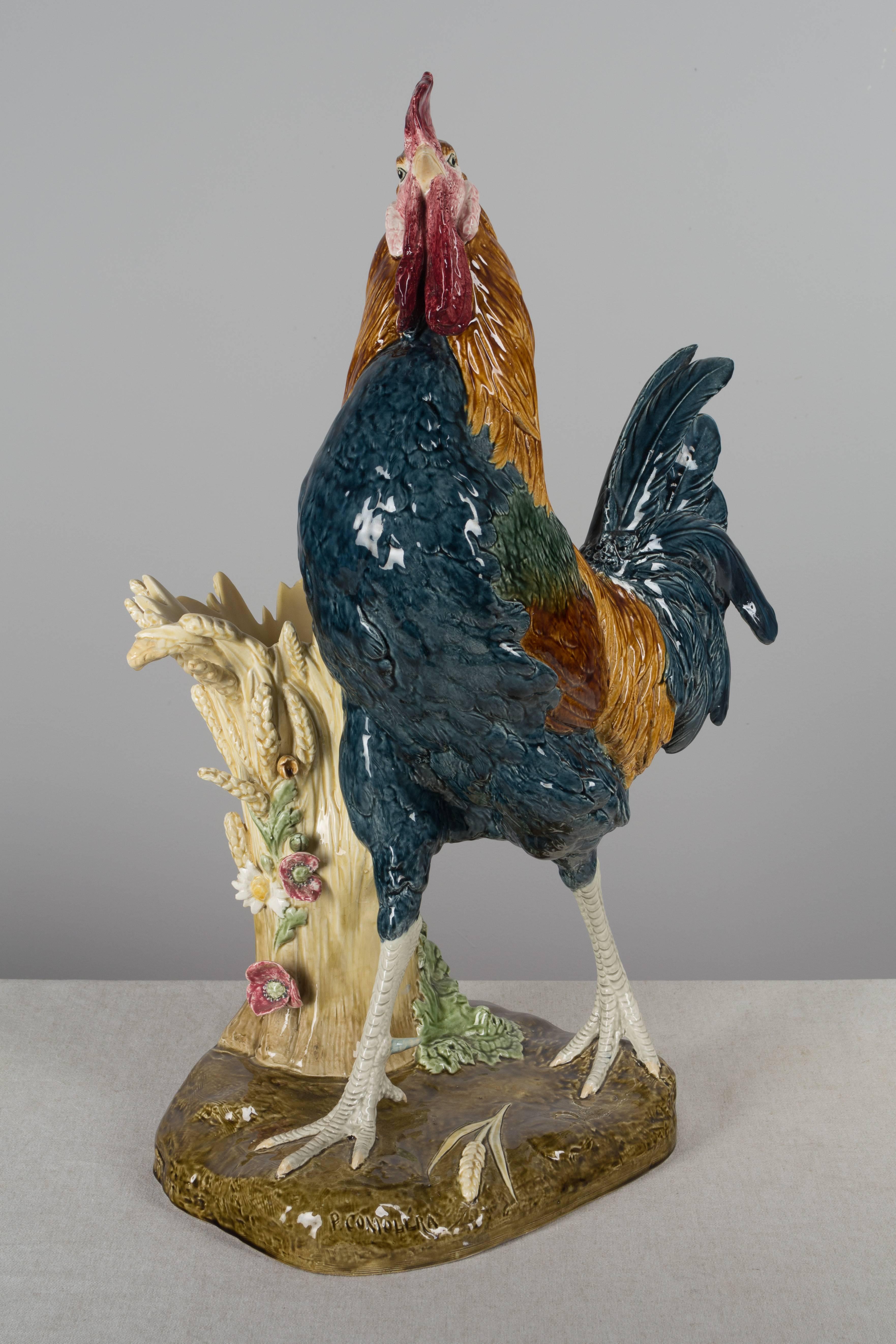 A 19th century French Majolica rooster by Paul Comolera for Choisy le Roi. A magnificent large-scale sculpture of exceptional artistry. Beautiful color and fine detail work in the bird's feathers and the sheaf of wheat that forms the vase. In