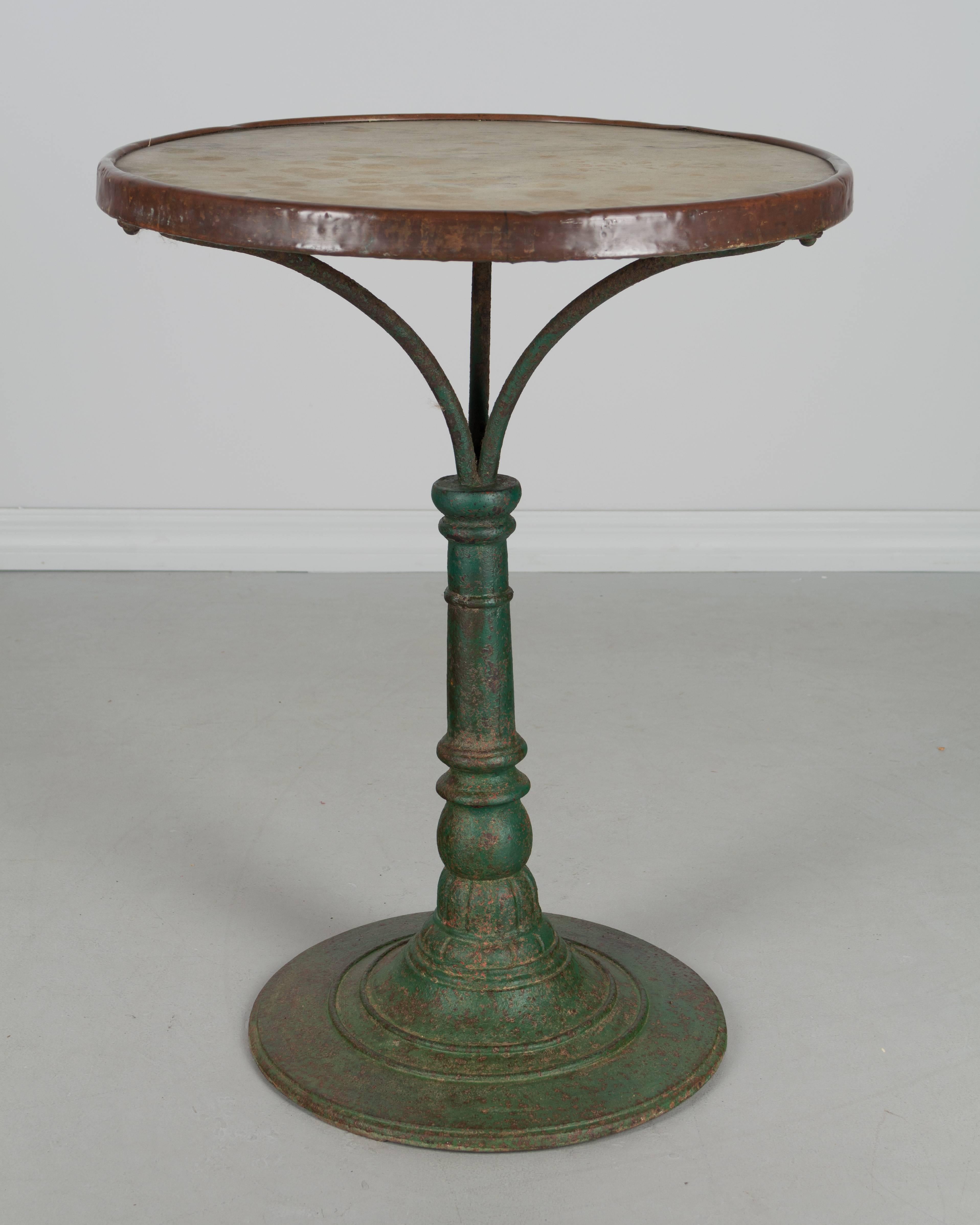 A 19th century. French cast iron bistro table with old green painted patina. Original marble-top with brass rim.
More photos available upon request. We have a large selection of French antiques. Please visit our showroom in Winter Park, Florida.