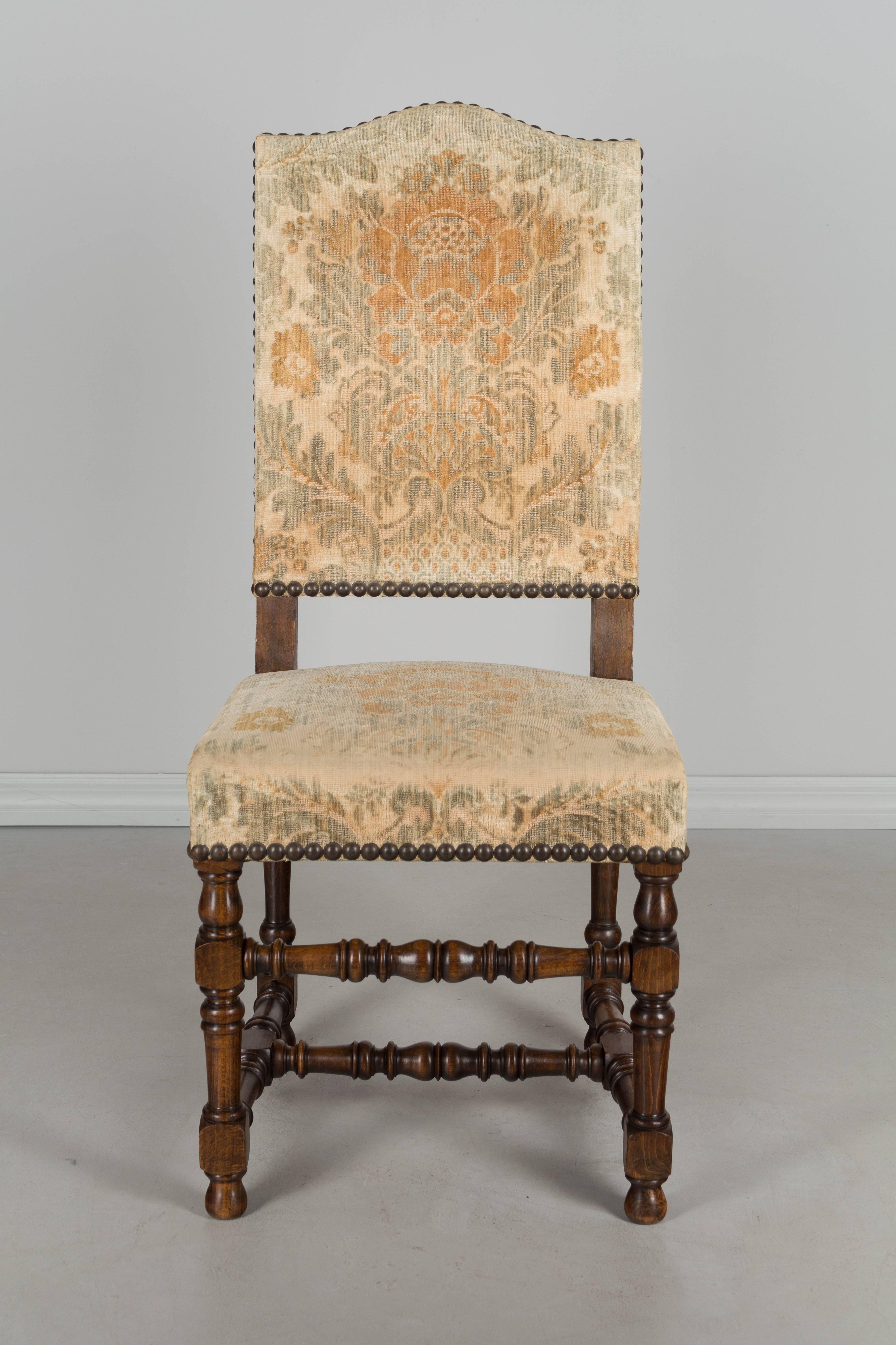 Set of 10 French Louis XIII style dining chairs made of beechwood with turned stretchers. Very sturdy and comfortable. Old upholstery is serviceable but varies in condition with some chairs showing greater wear than others.
More photos available