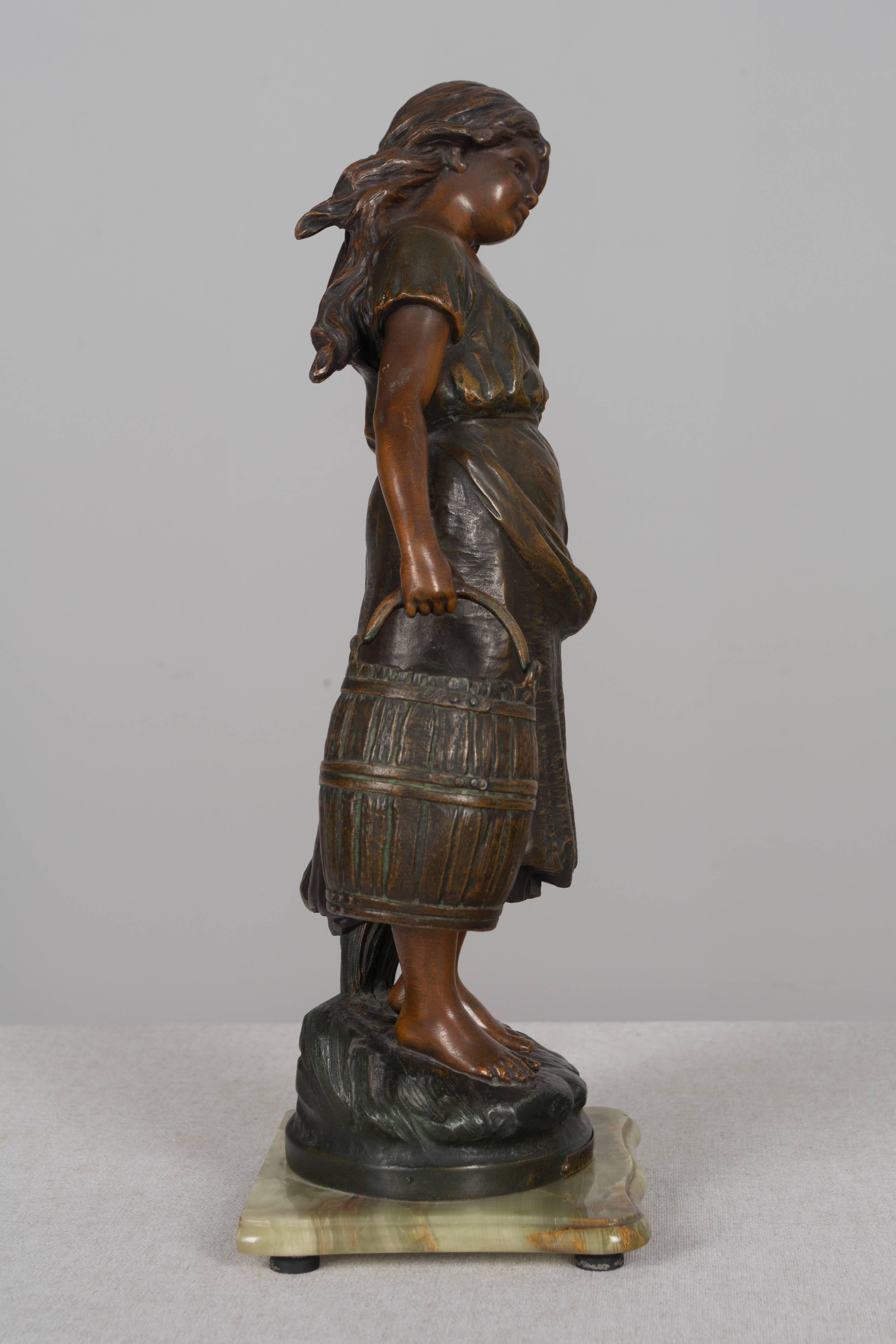 A 19th century French pot metal sculpture by Auguste Moreau (1834-1917) depicting Cosette, a fictional character in the novel Les Miserables by Victor Hugo. The base front has a stamped brass plaque: COSETTE par L. et F. Moreau (Medaille d'Or). Well