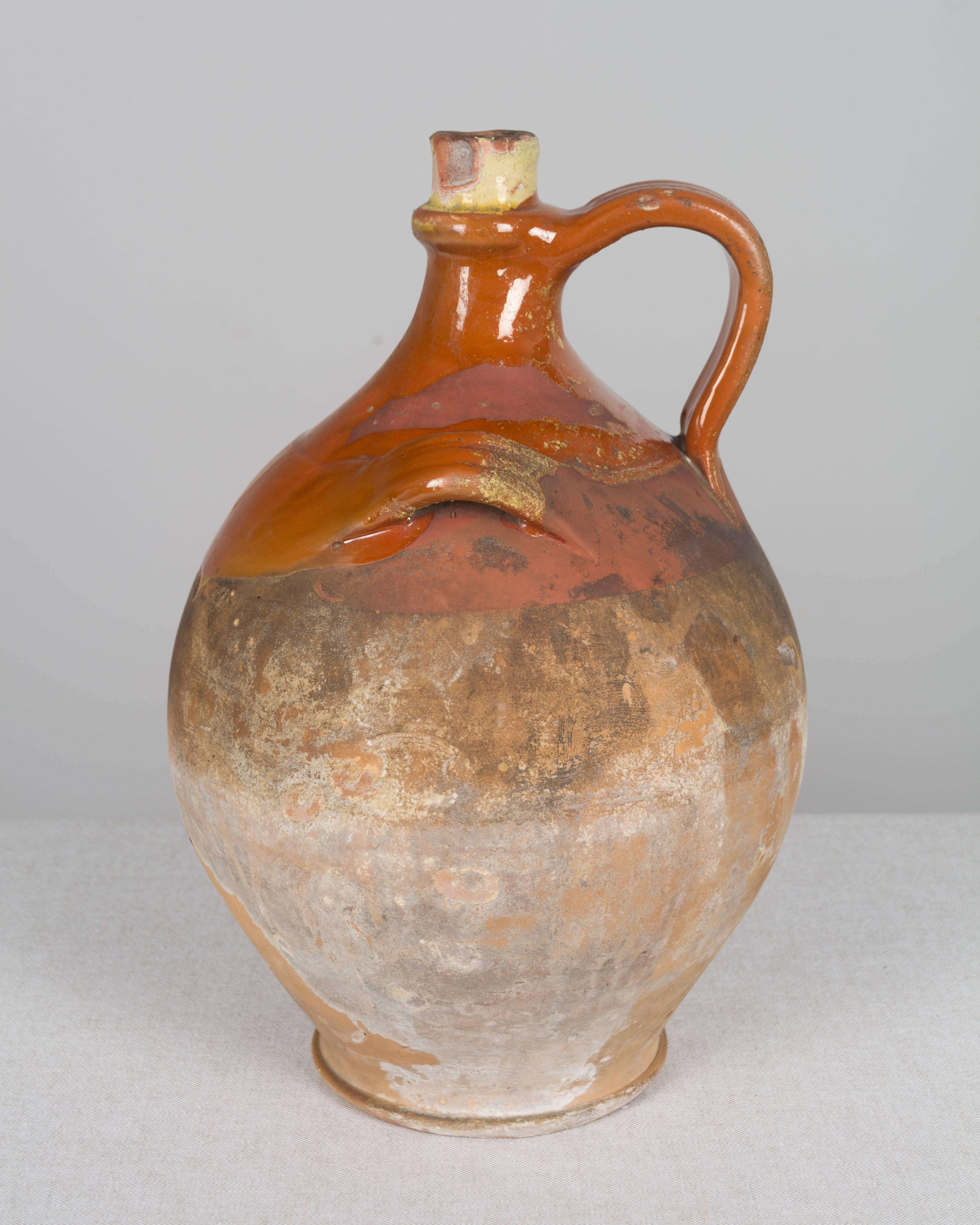 A 19th century French terracotta jug from the Southwest of France, circa 1880-1900. Measure: 14